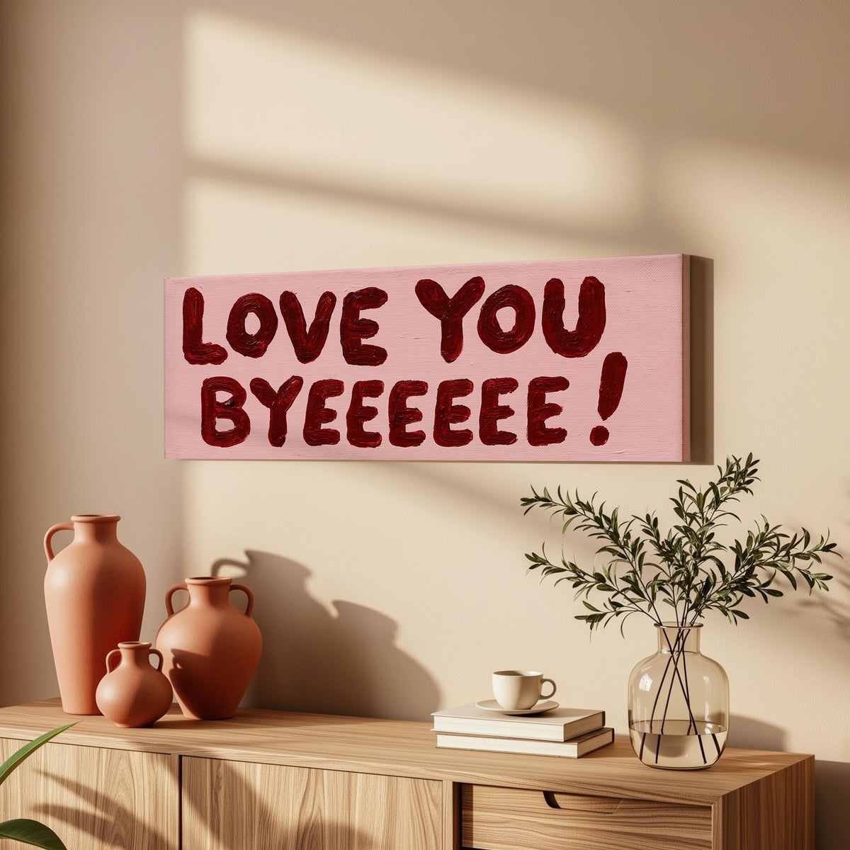 Love you byeeeee retro quote long horizontal canvas print above a sofa in a living room