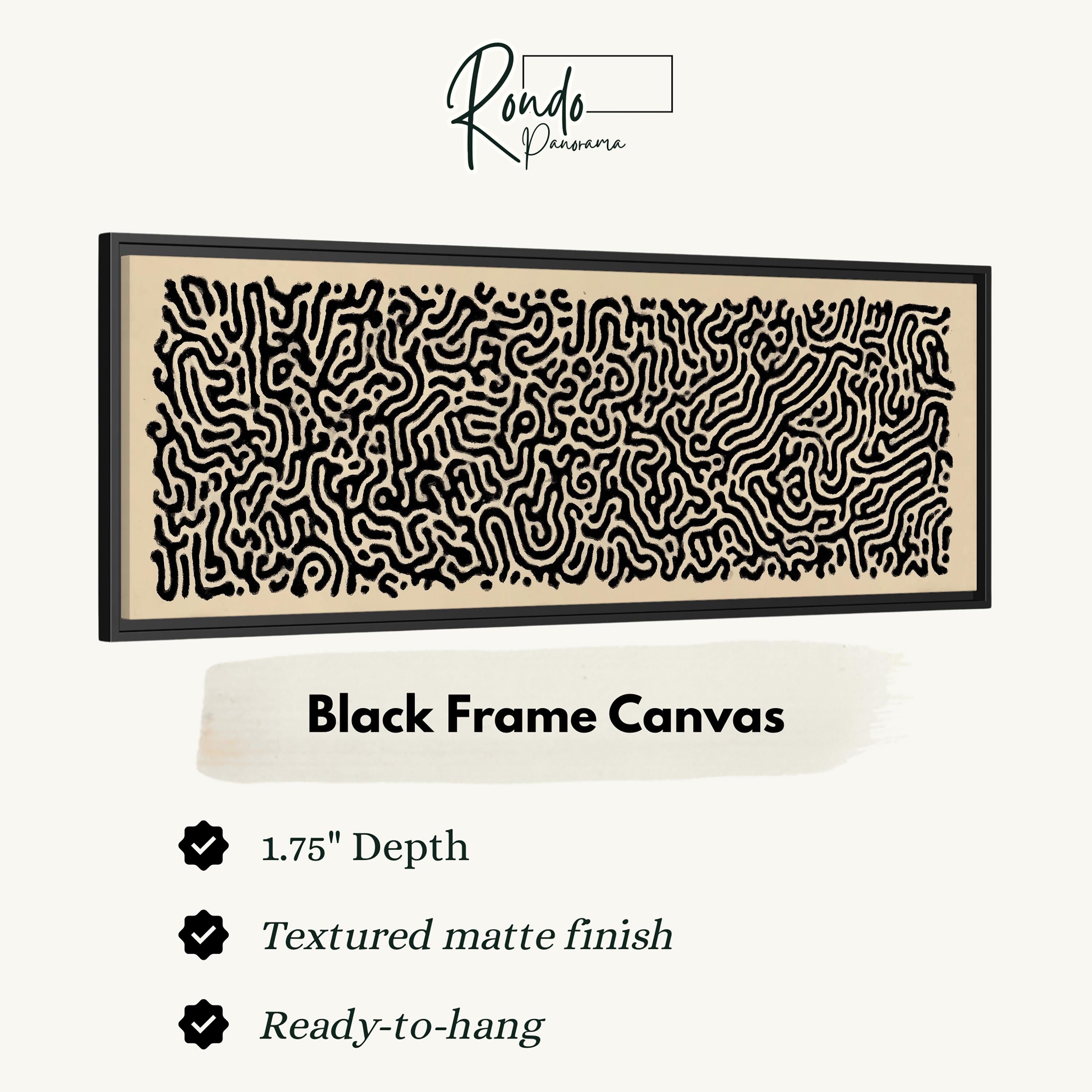 a black frame canvas with a detailed, abstract pattern in black and white.