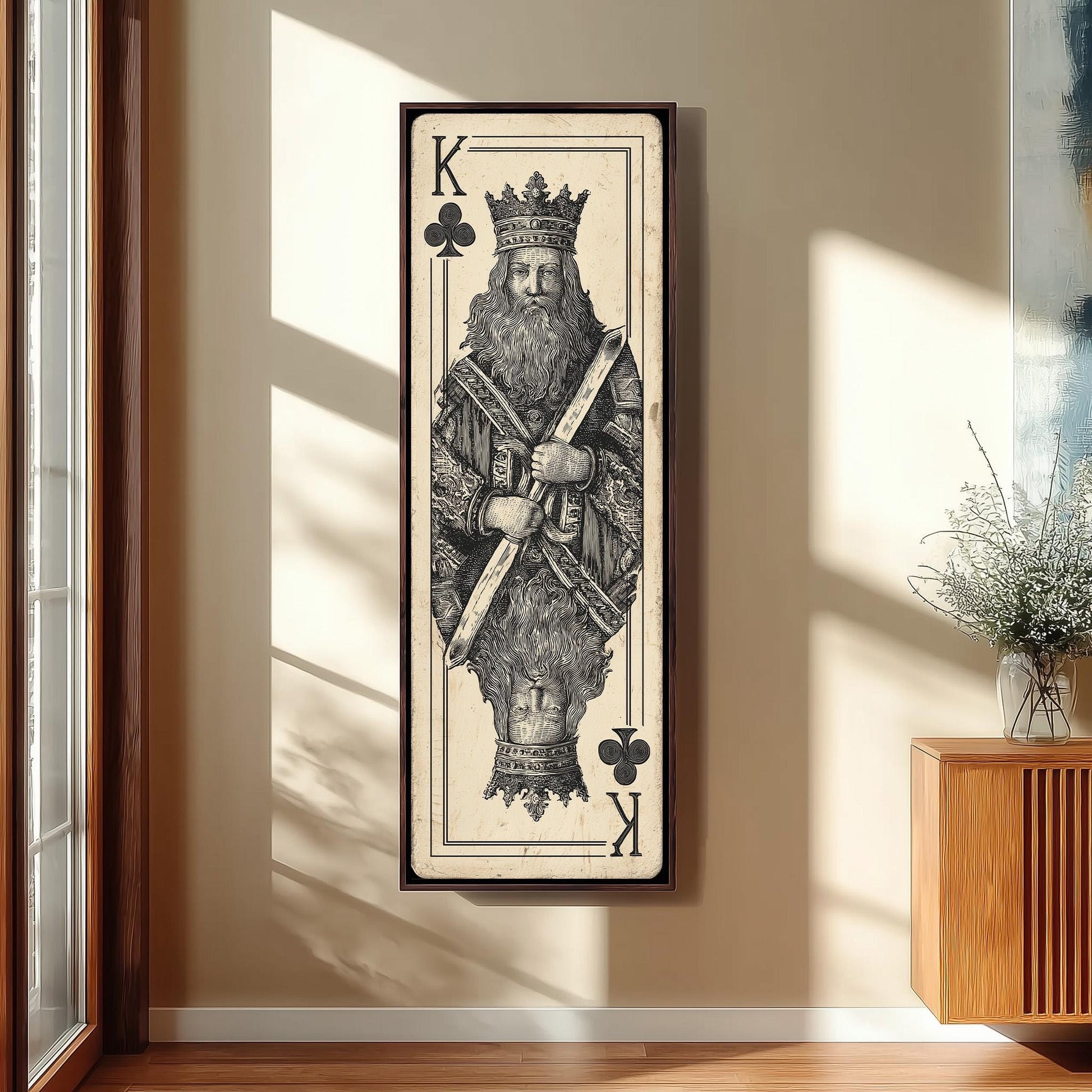 a large framed artwork depicting a king, with the king wearing a crown and holding a club in his hand.