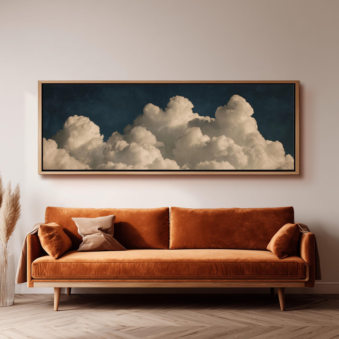 Cumulus clouds against a dark night sky long horizontal canvas print above a sofa in a living room