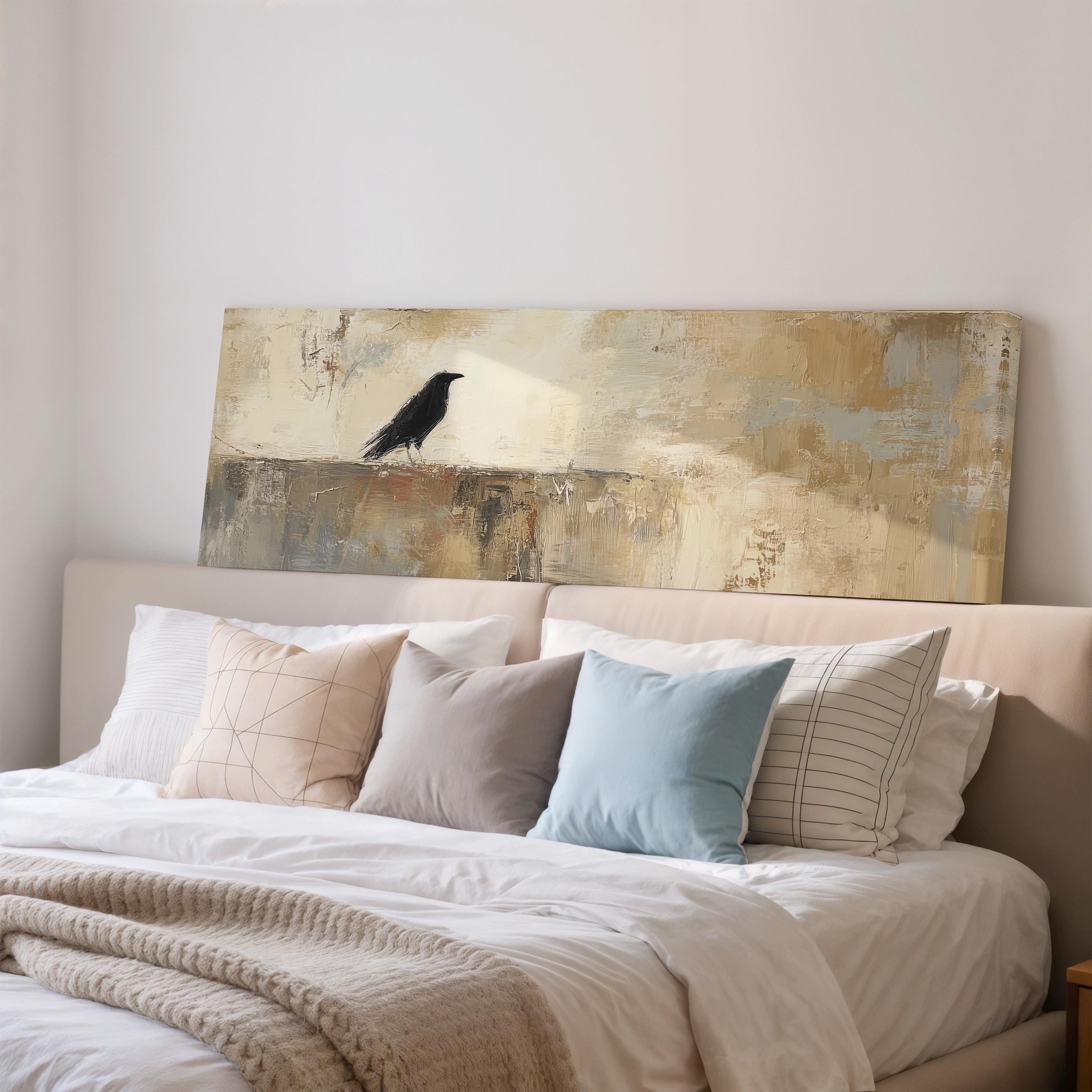 a bedroom with a large bed covered in white sheets and pillows. Above the bed, there is a painting of a black bird perched on a ledge.