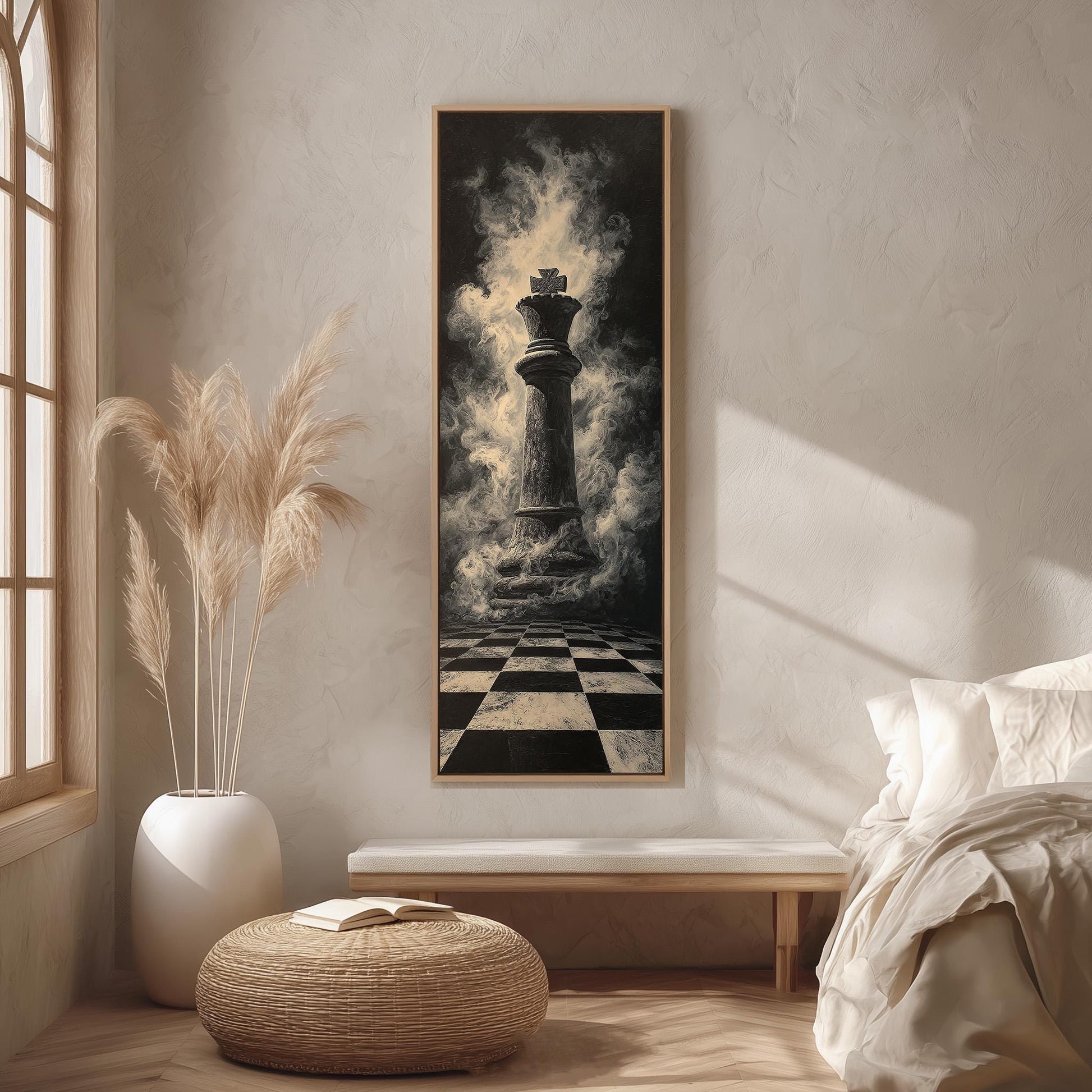 a large black and white painting of a chess king on a checkered floor, with smoke rising from it, hanging on a wall in a room with a bed, a potted plant, and a wicker ottoman.