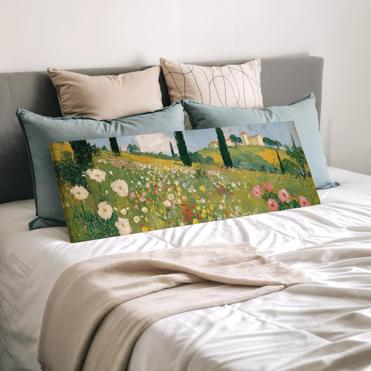Tuscan wildflower hillside with cypress trees wide panoramic canvas print laid on a bed to show its size