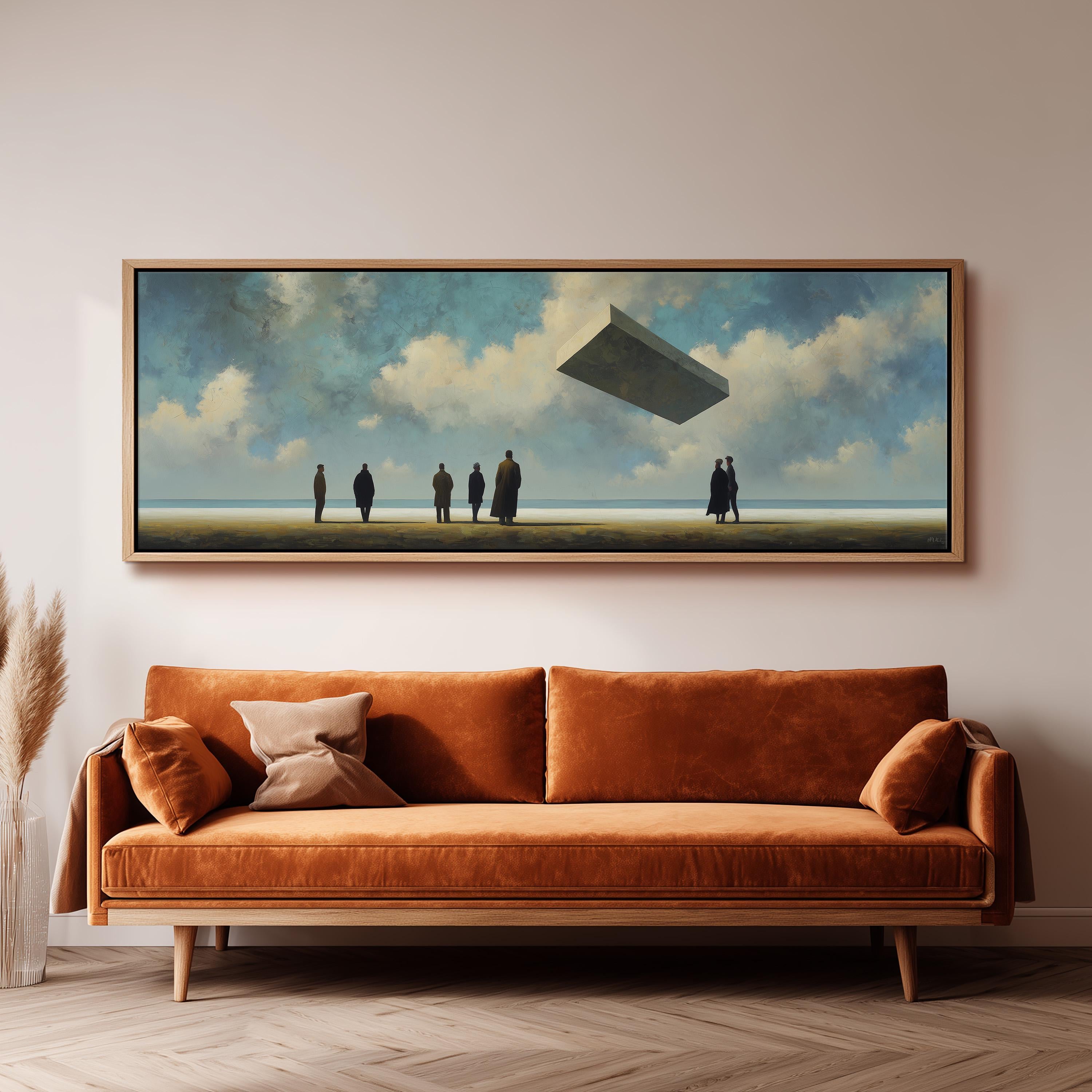 a large painting of a group of people standing on a beach, with a large object flying above them. The painting is hung on a wall above a brown sofa.