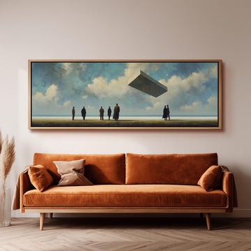 a large painting of a group of people standing on a beach, with a large object flying above them. The painting is hung on a wall above a brown sofa.
