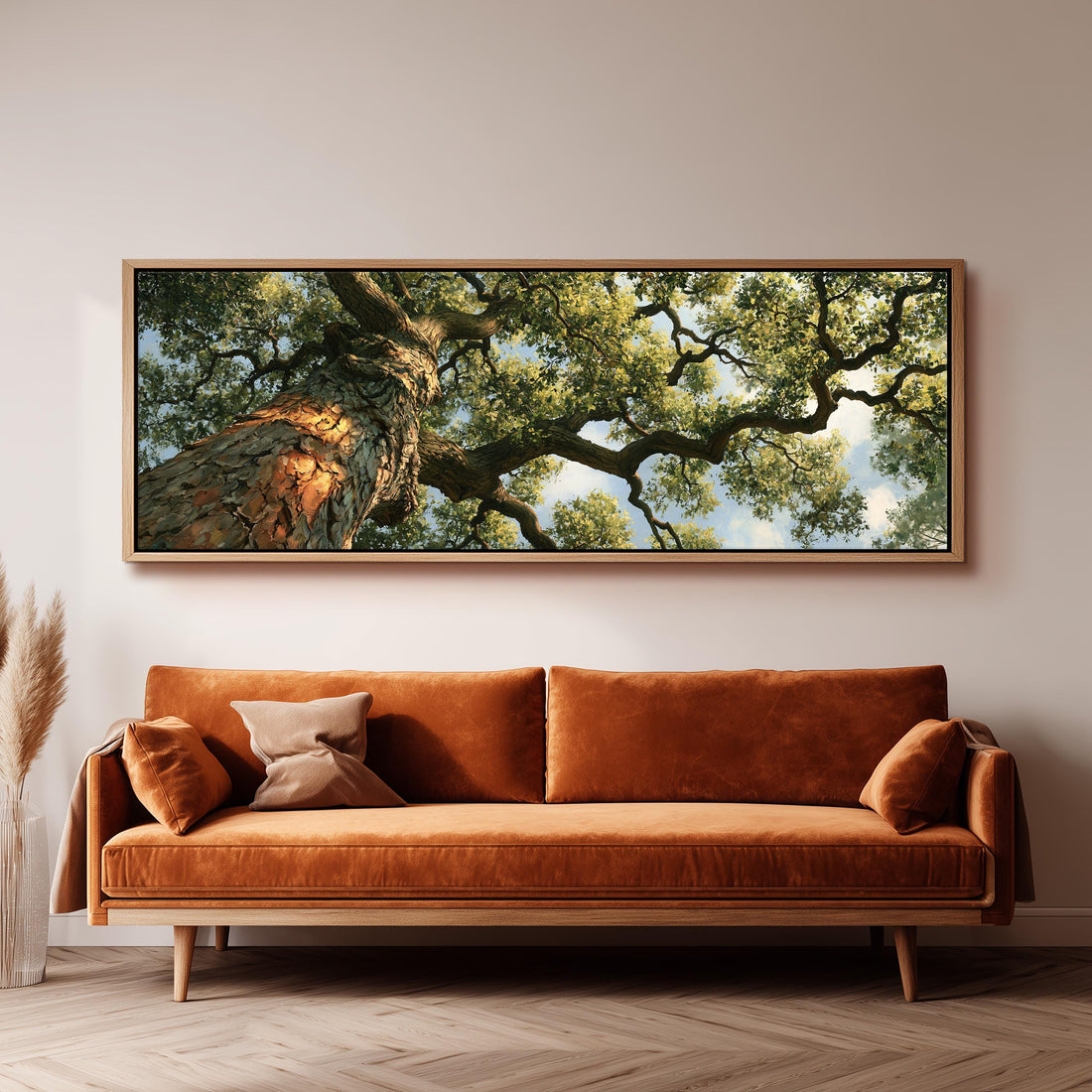 Ancient oak trunk and branches seen from below long horizontal canvas print above a sofa in a living room