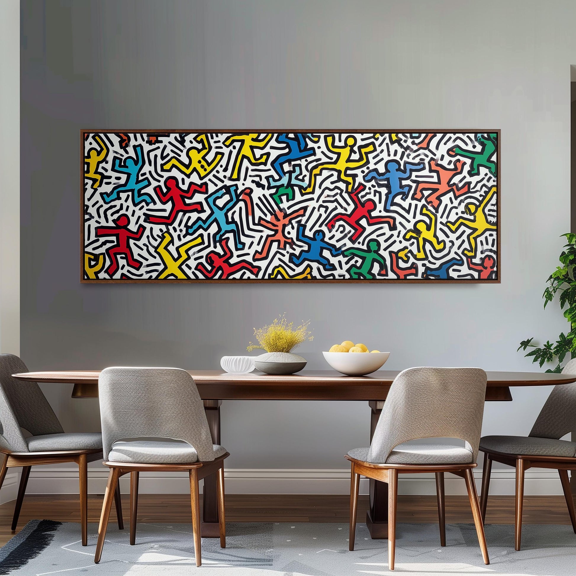 a dining room with a large abstract painting hanging on the wall above a wooden table with four chairs. The painting is colorful and depicts various figures in different poses.