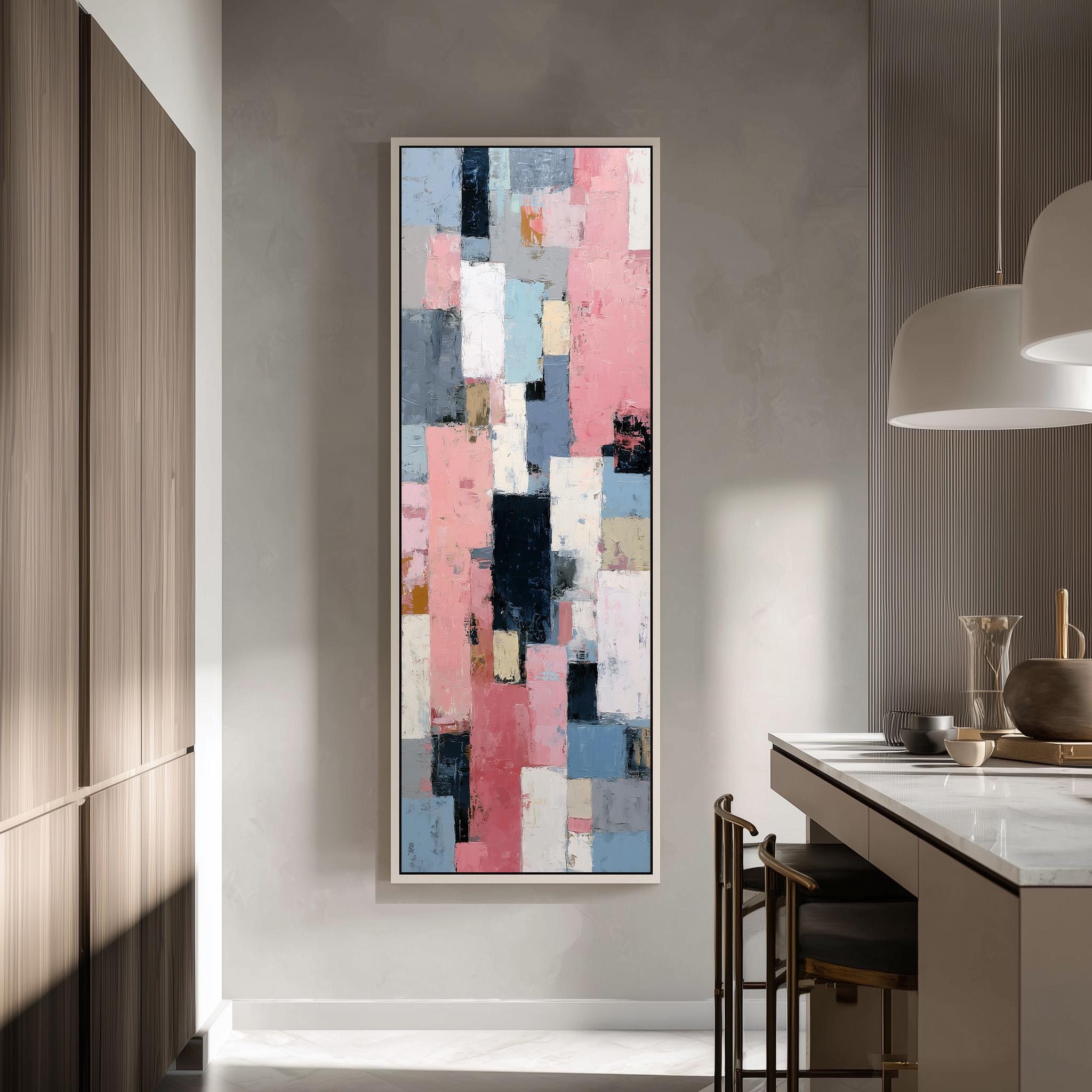 a large abstract painting hanging on a wall in a modern kitchen.