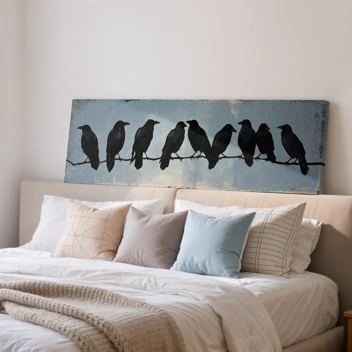 Crows gathered on a branch wide panoramic canvas print above a bed in a bedroom
