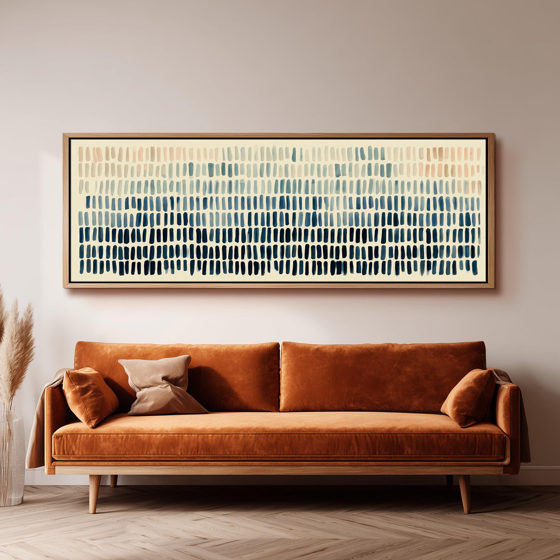 Brushmarks fading from peach to navy long horizontal canvas print above a sofa in a living room