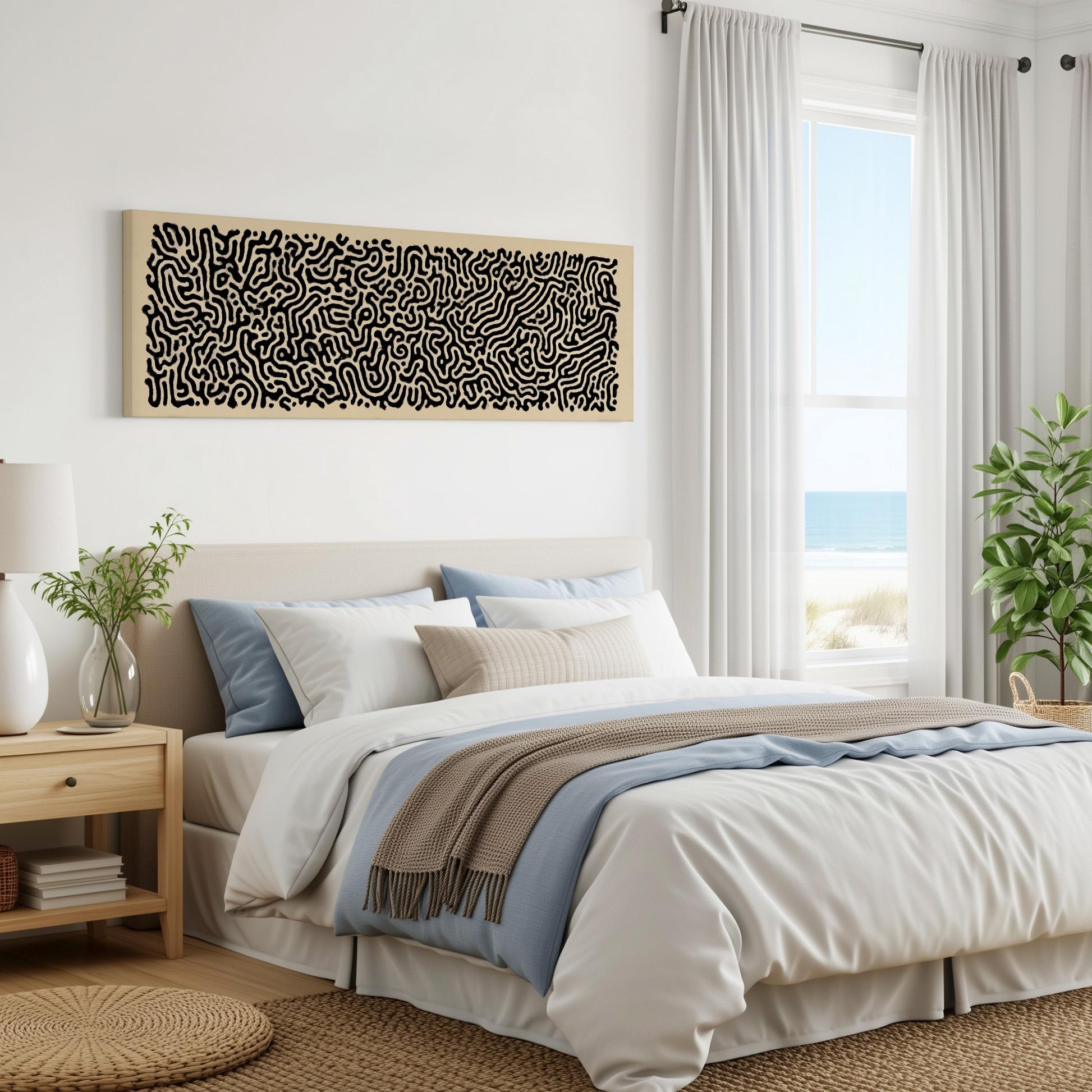 a serene and modern bedroom with a large bed, a nightstand, and a large window overlooking the ocean. The room has a minimalist and clean design, with white walls and a neutral color palette.