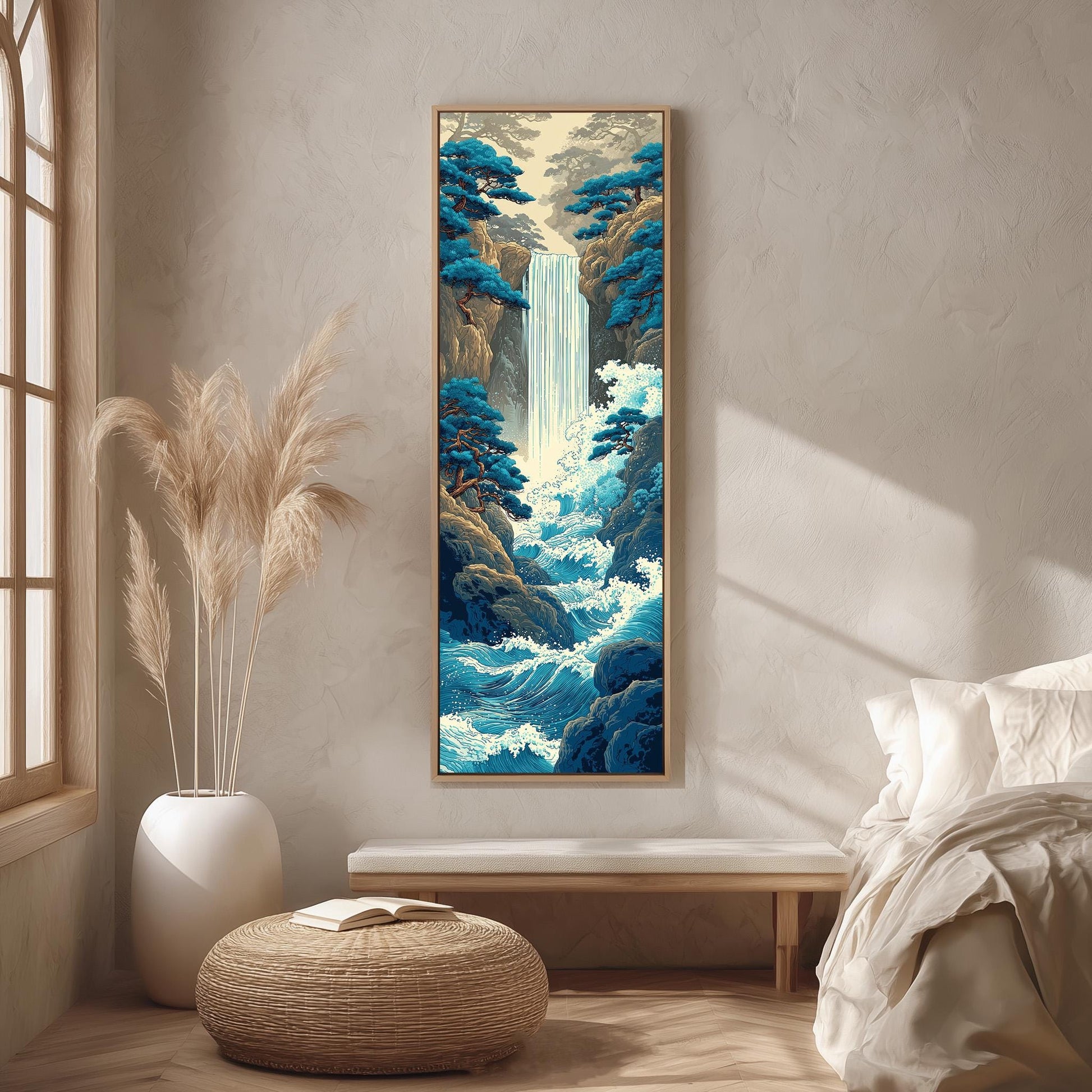 a serene indoor setting with a large painting of a waterfall hanging on the wall. The painting is framed in a wooden frame and is surrounded by a white vase filled with tall, light-colored reeds. The room has a minimalist and modern design, with a bed, a bench, and a potted plant placed in the foreground.
