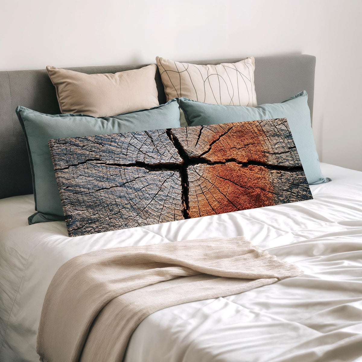 Copper cracked wood grain wide panoramic canvas print laid on a bed to show its size