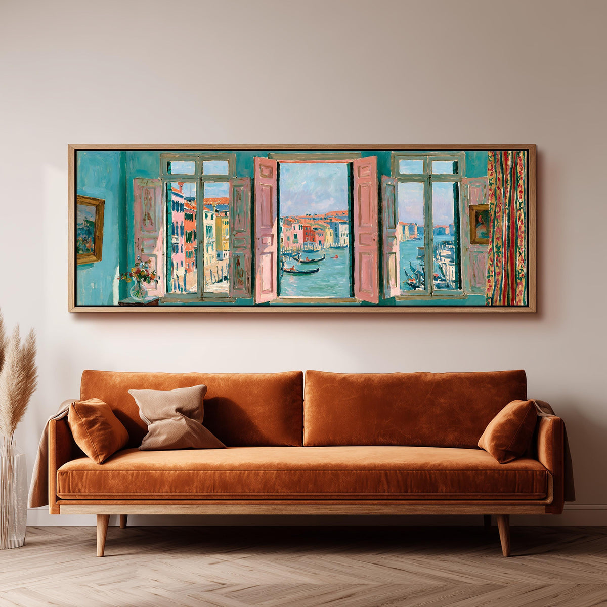 Venice canal and gondolas through a window panoramic canvas print above a sofa in a living room