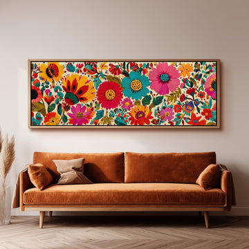 a large, colorful floral print hanging on a wall above a brown sofa.
