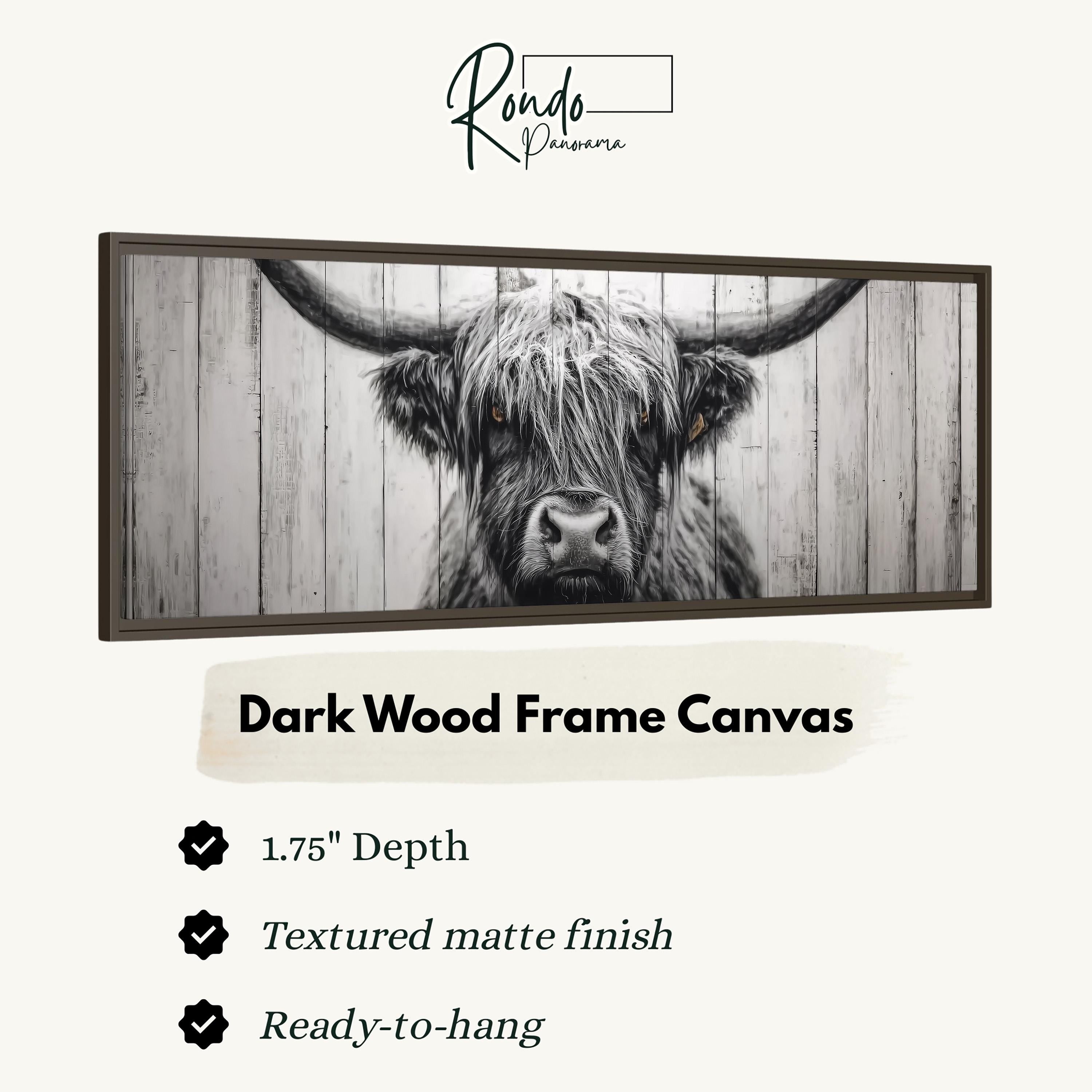 a close-up of a horned animal, possibly a yak or a bull, with a dark wood frame.
