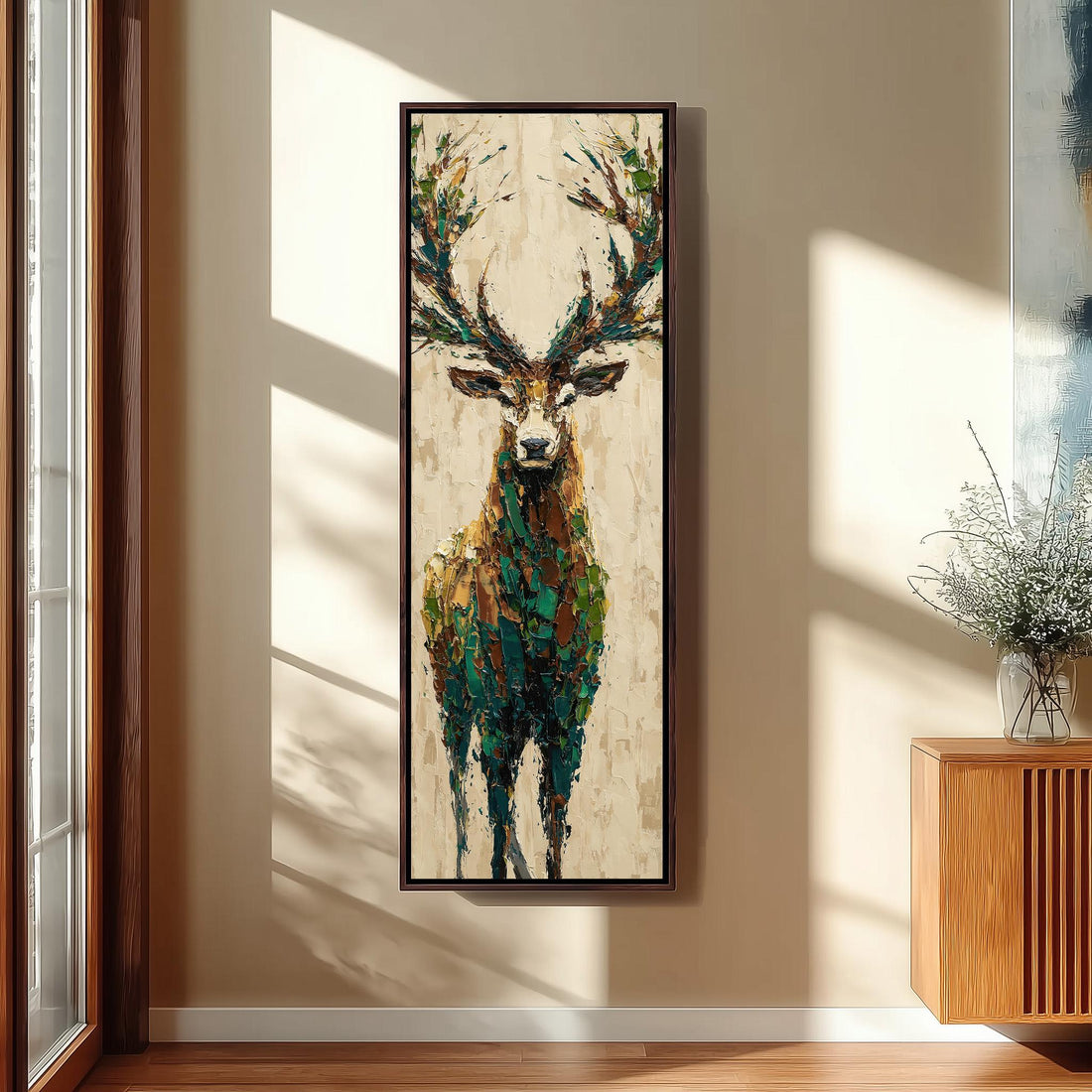 a large painting of a deer with antlers hanging on a wall in a room with a wooden floor and a window.