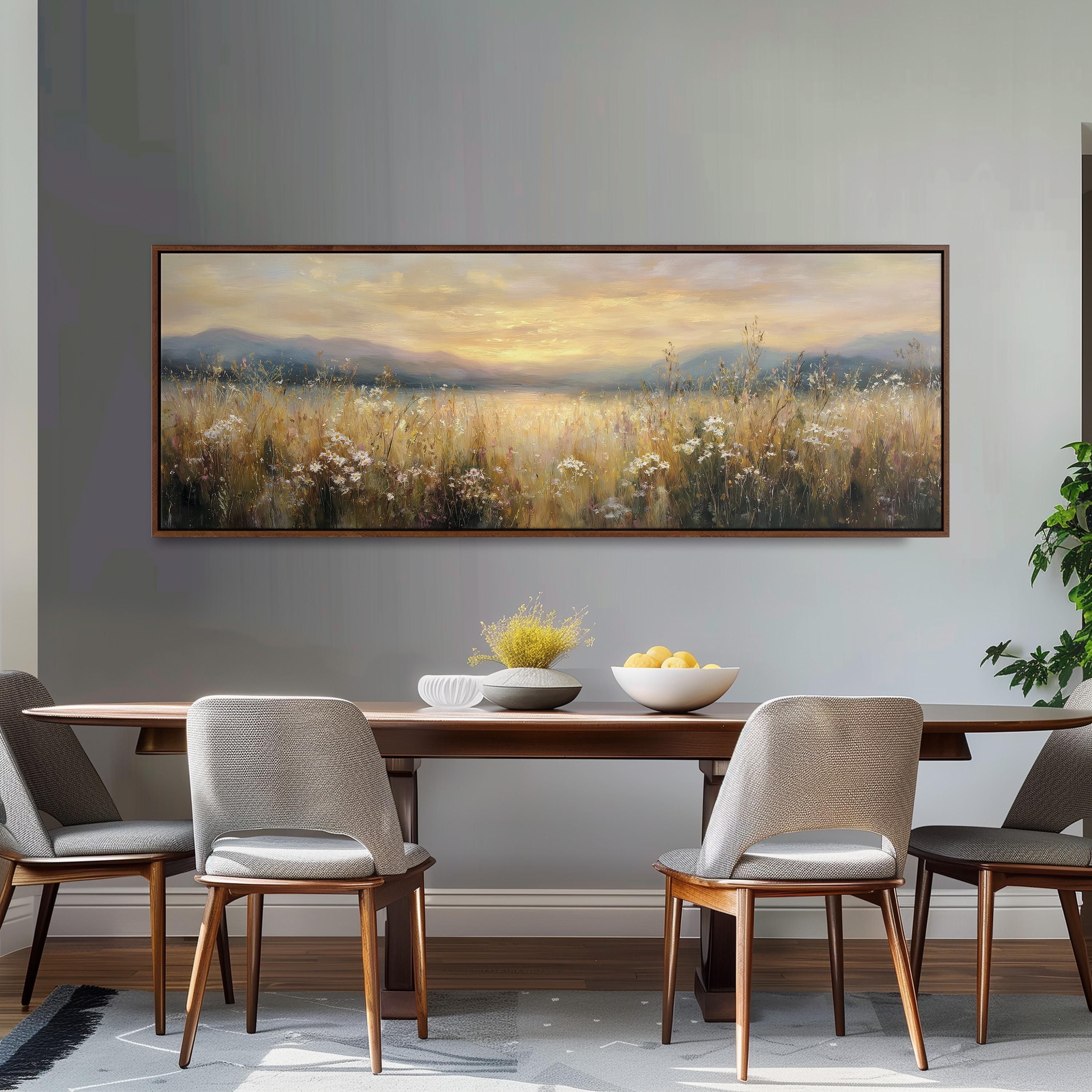 a dining room with a large painting of a field of flowers hanging on the wall above a wooden dining table with four chairs. The table is set with a bowl of fruit and a vase of flowers, creating a cozy and inviting atmosphere.
