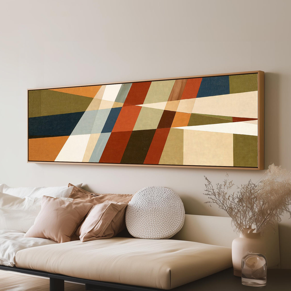 Rust and navy diagonal color blocks panoramic canvas print above a sofa in a living room