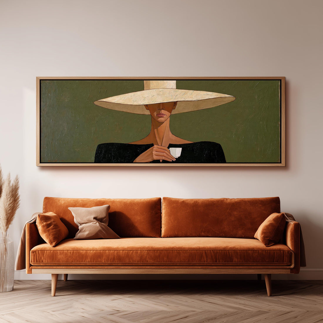 Woman in a wide sun hat holding an espresso long horizontal canvas print above a sofa in a living room