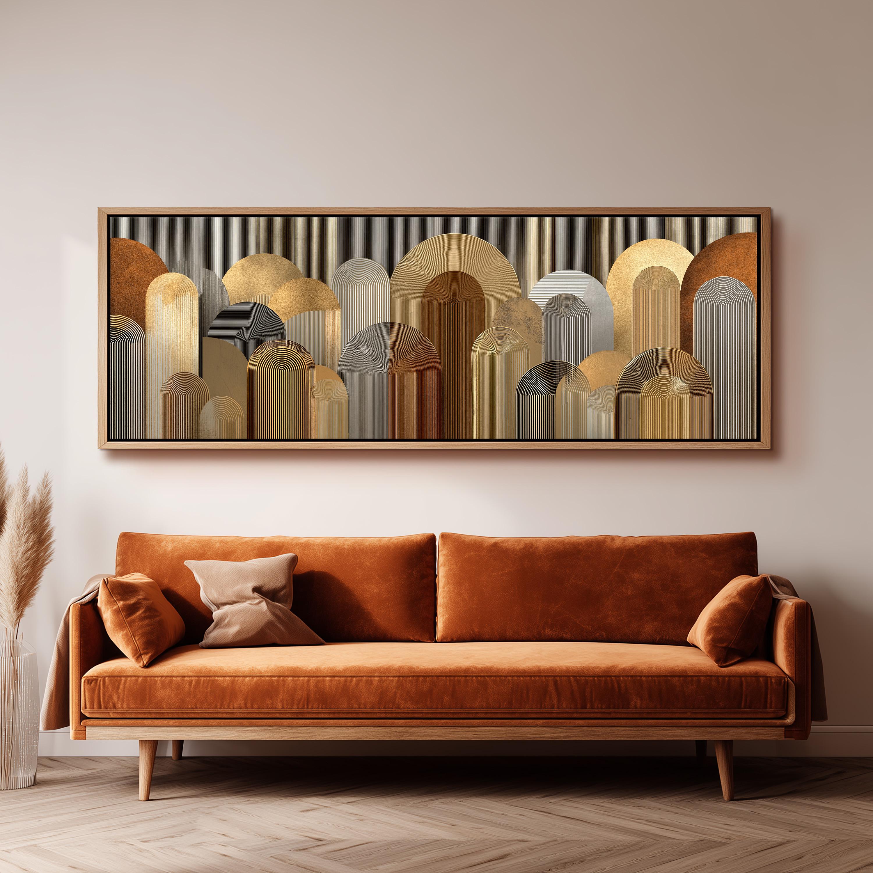 a large, abstract painting hanging on a wall above a brown sofa with a wooden frame.
