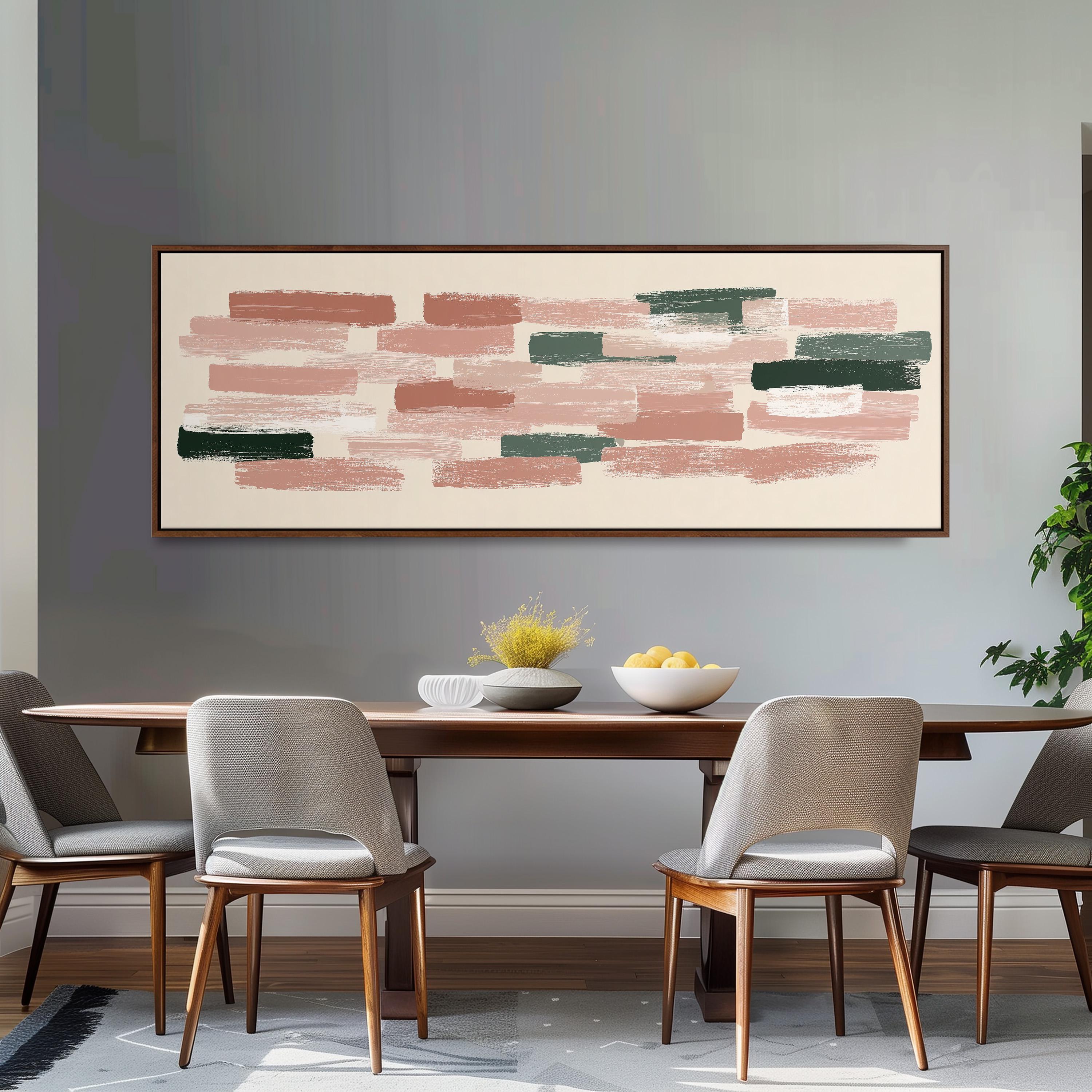 a dining room with a wooden table and four chairs. Above the table, there is a large abstract painting with pink, green, and white brushstrokes. The table is set with a bowl of fruit and a vase of flowers.