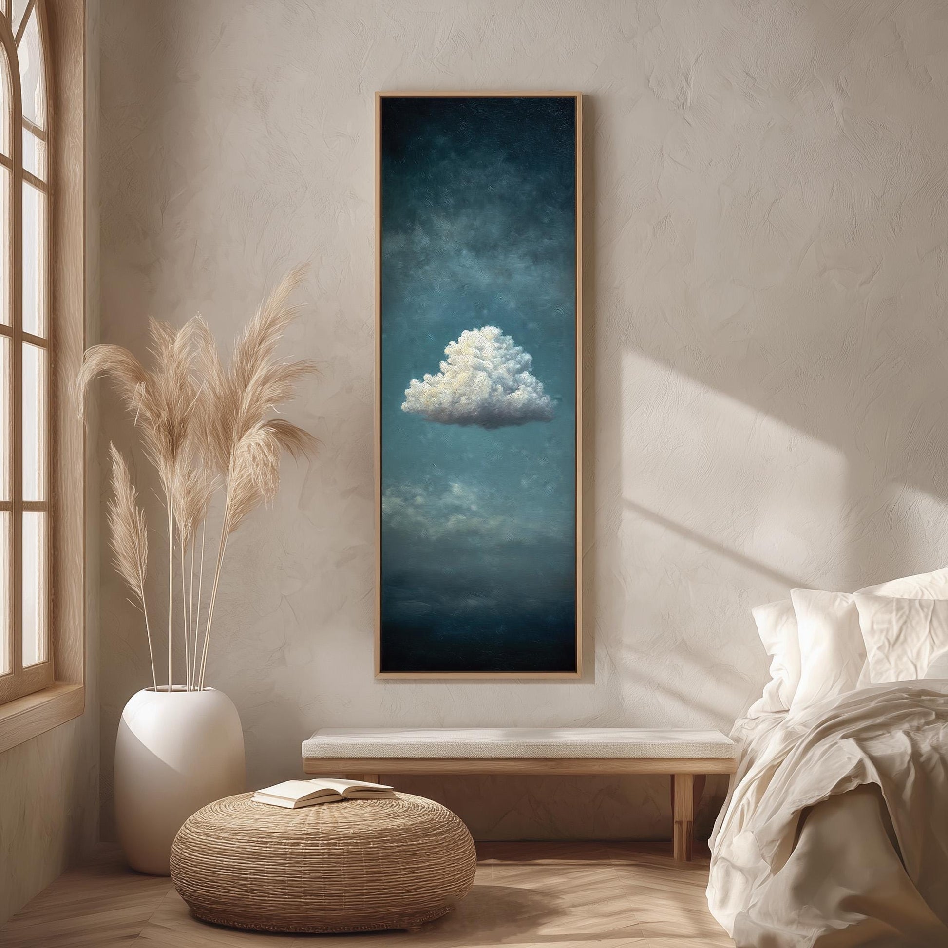 a serene bedroom scene with a large framed painting of a cloud hanging on the wall, a white bed with a white pillow, a white vase with tall potted plants, and a woven ottoman.