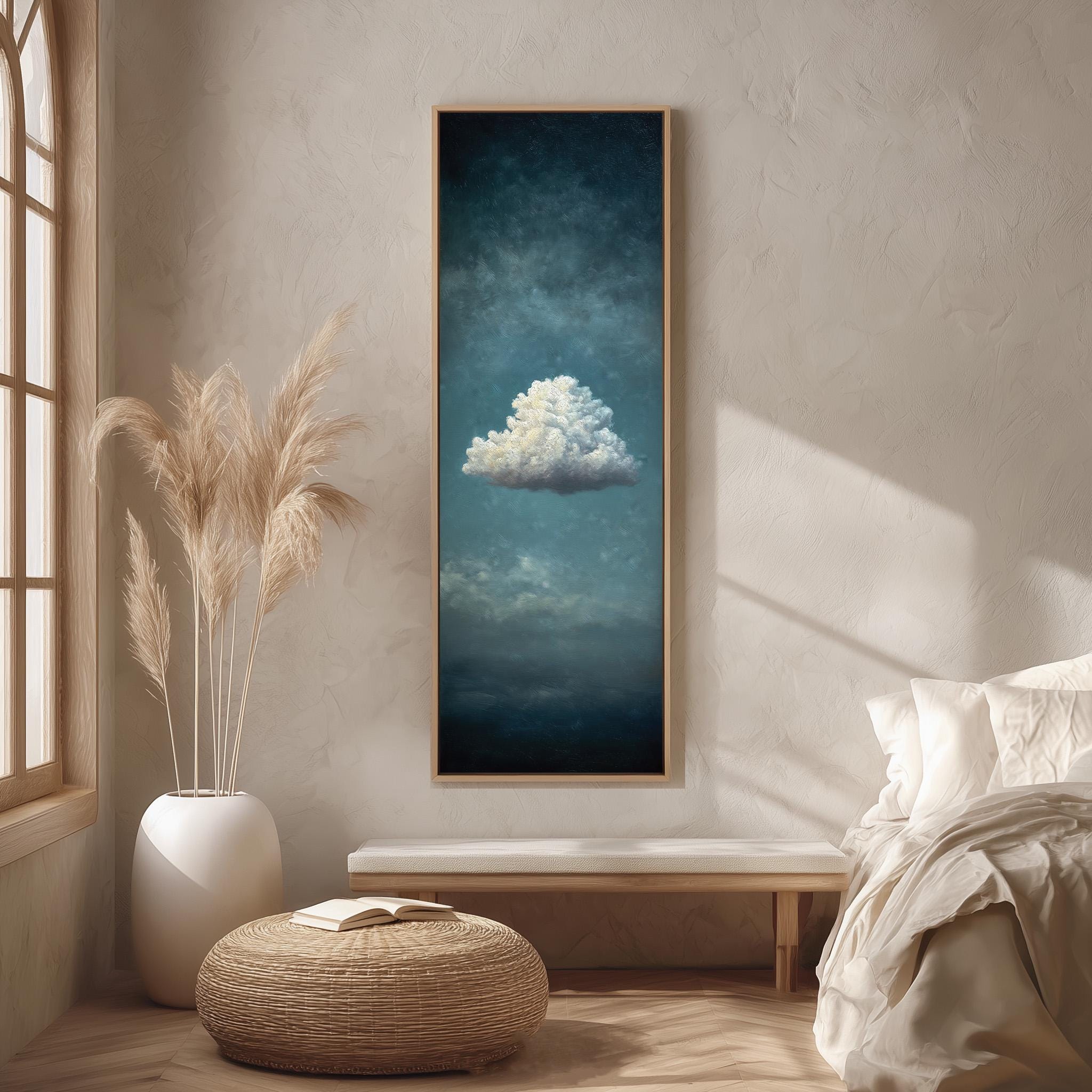a serene bedroom scene with a large framed painting of a cloud hanging on the wall, a white bed with a white pillow, a white vase with tall potted plants, and a woven ottoman.