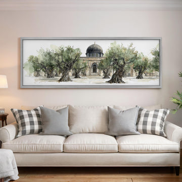 a large painting of a building with a dome, surrounded by trees, hanging on a wall above a white sofa with gray and white plaid throw pillows.