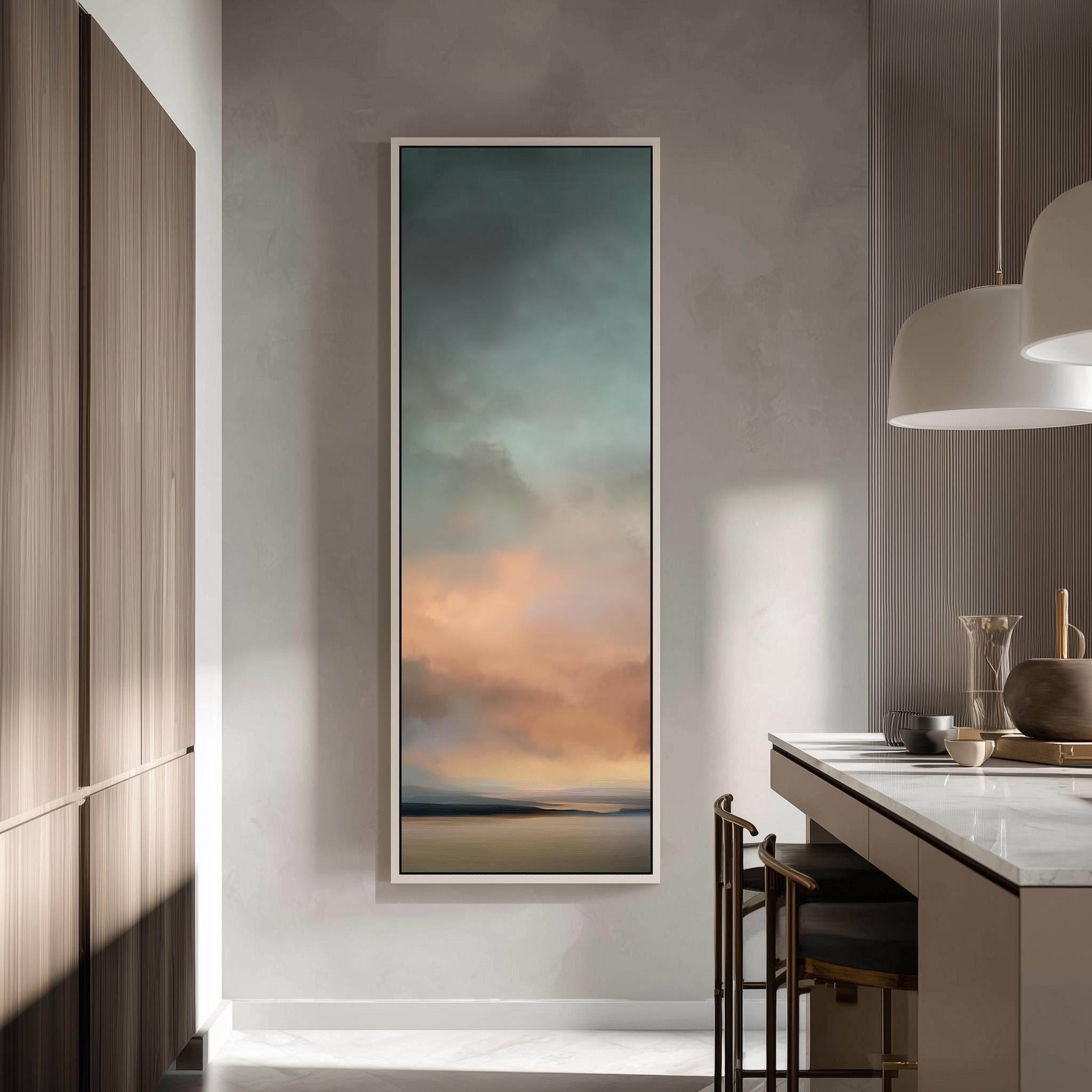 a modern kitchen with a large painting of a sunset landscape hanging on the wall.