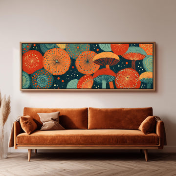 Orange and teal mushroom starburst long horizontal canvas print above a sofa in a living room