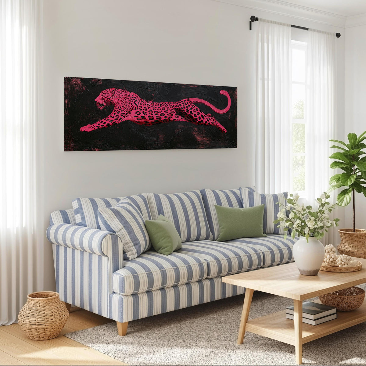 Pink leaping leopard long horizontal canvas print above a striped sofa in a coastal living room