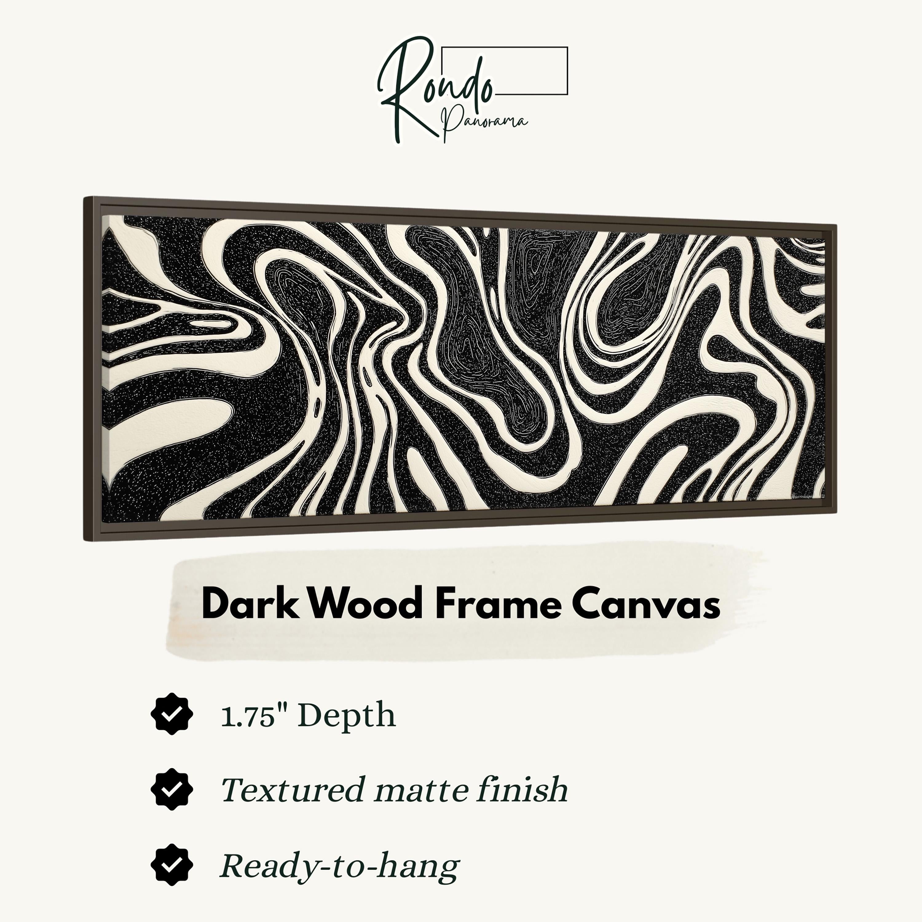 a dark wood frame canvas with a black and white zebra-like pattern.