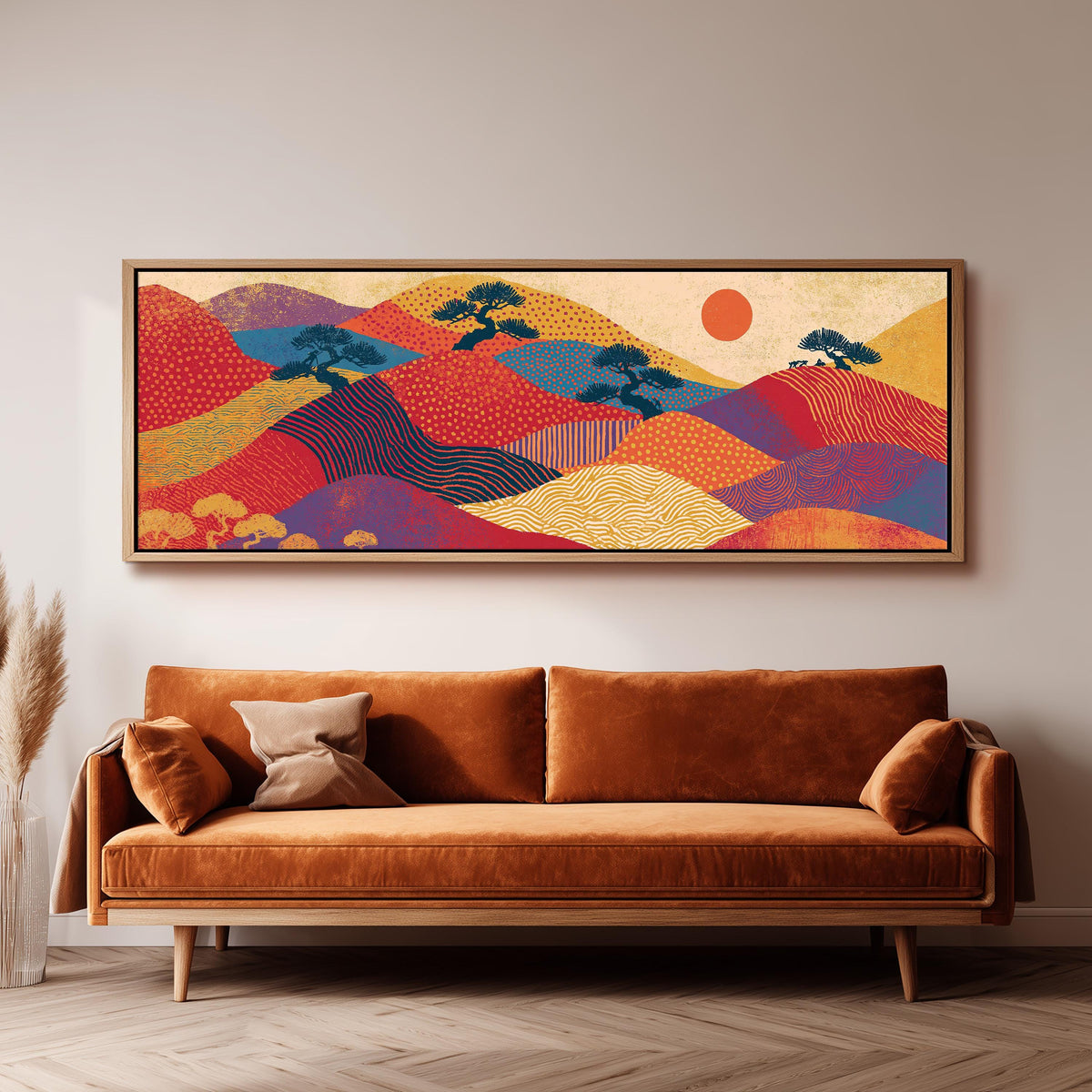 Bonsai trees on patterned hills with a red sun long horizontal canvas print above a sofa in a living room