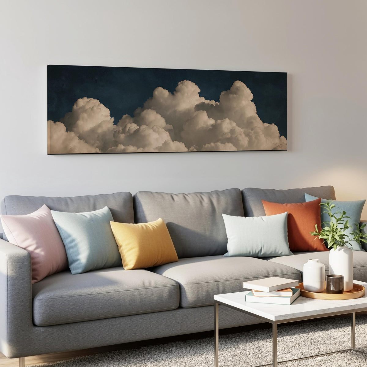 Cumulus clouds against a dark night sky panoramic canvas print above a grey sofa in a living room