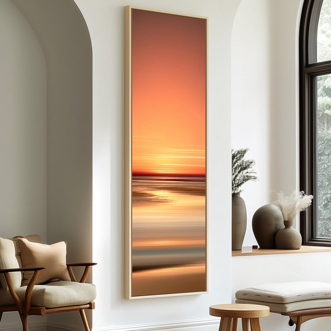 a serene bedroom scene with a large window, a white bed, a woven ottoman, and a framed landscape painting of a sunset over the ocean.