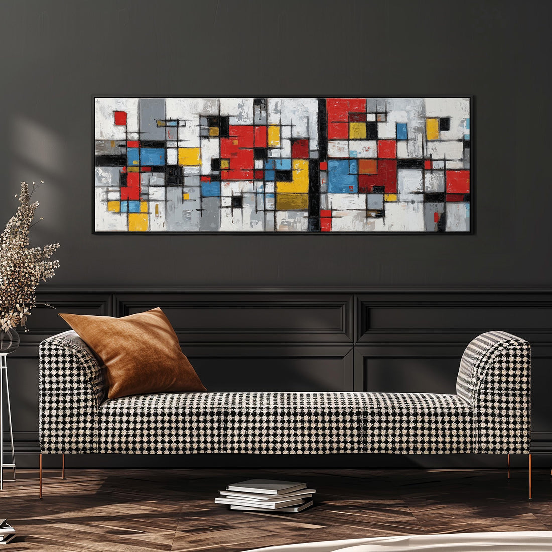 a modern living room with a black and white checkered sofa, a stack of books, and a large abstract painting hanging on the wall above the sofa.