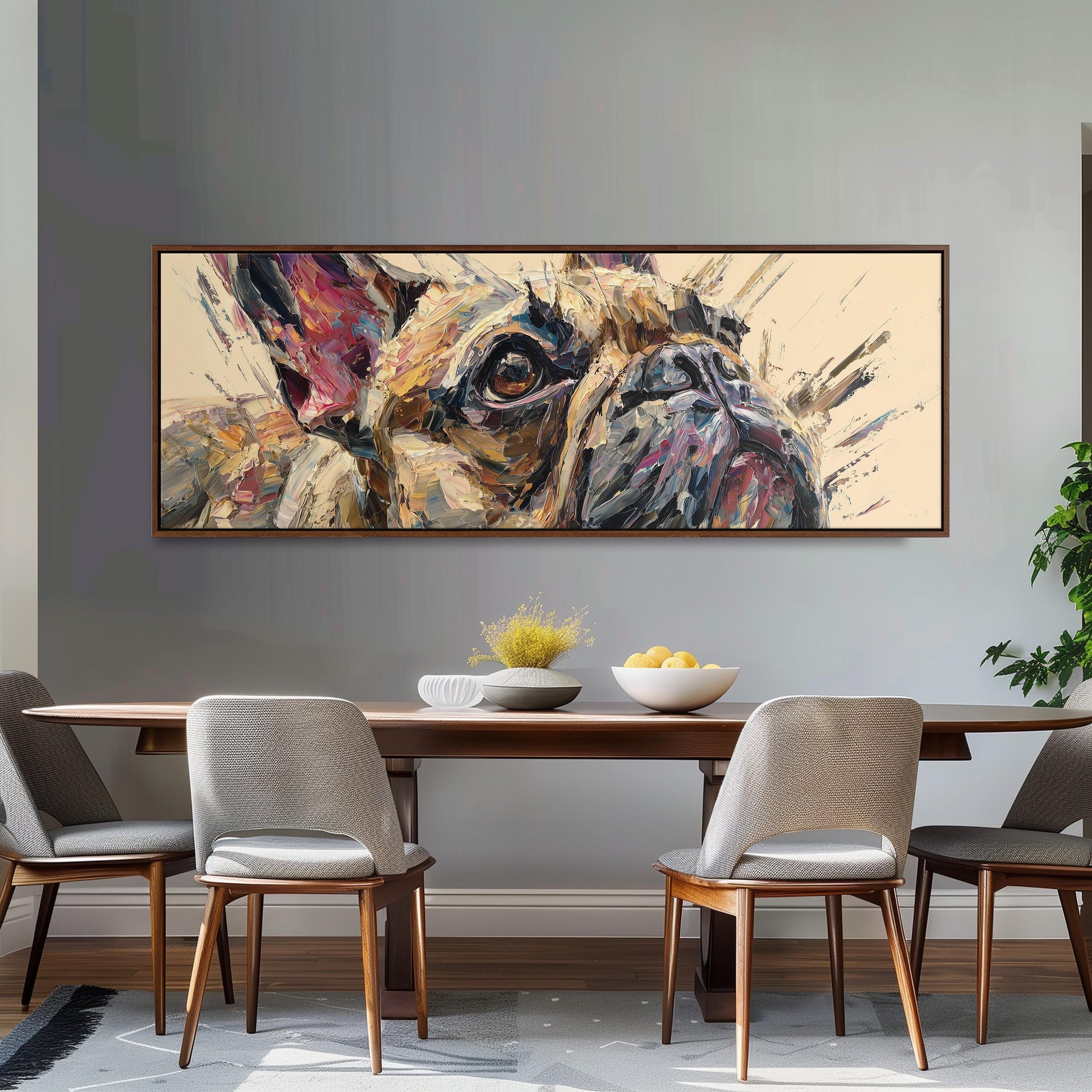 a large, colorful painting of a dog's face hanging on a wall above a wooden dining table with four chairs.