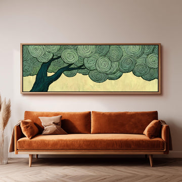 Tree with a swirling green canopy long horizontal canvas print above a sofa in a living room