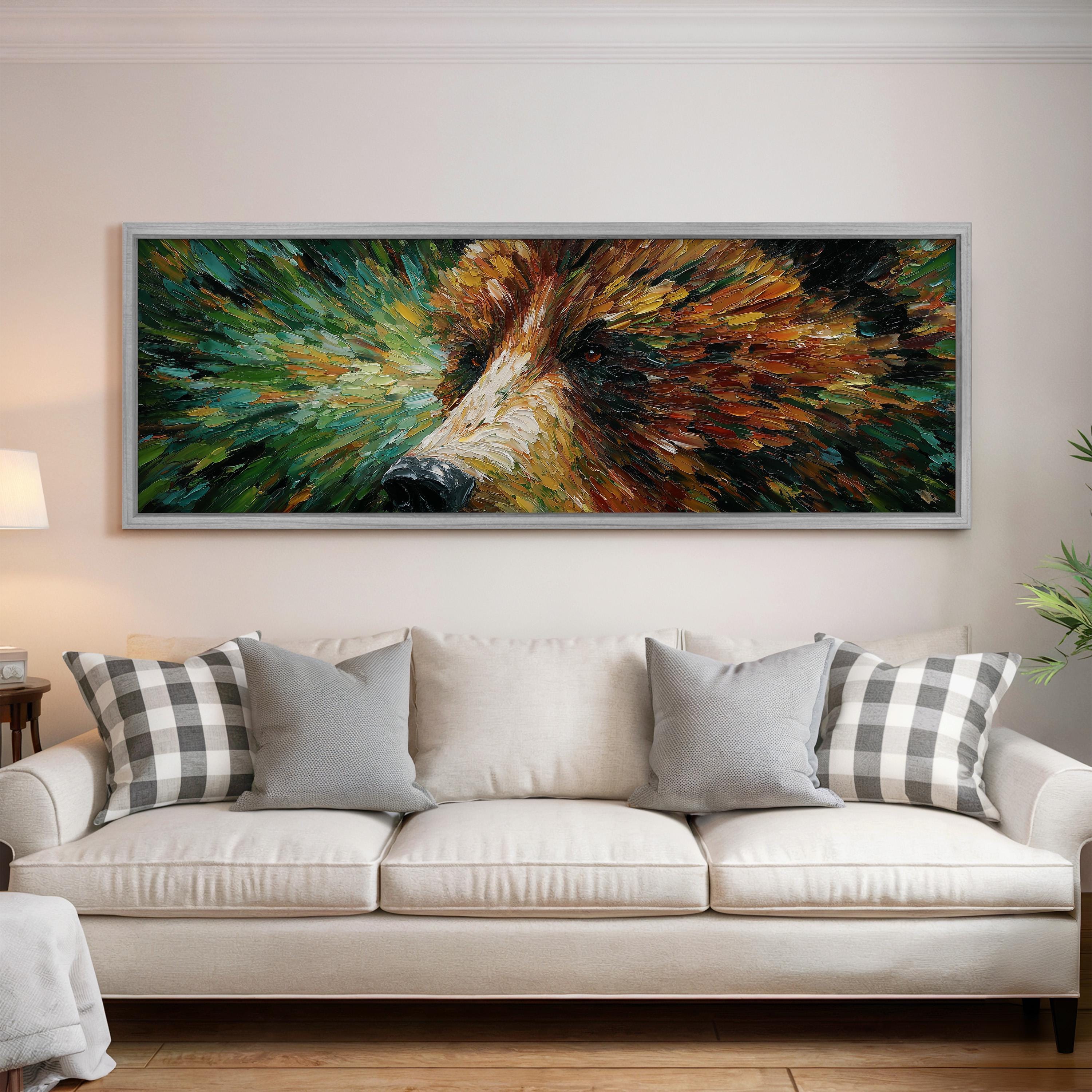 a large, colorful painting of a bear's face hanging on a wall above a white couch with gray and white plaid throw pillows.