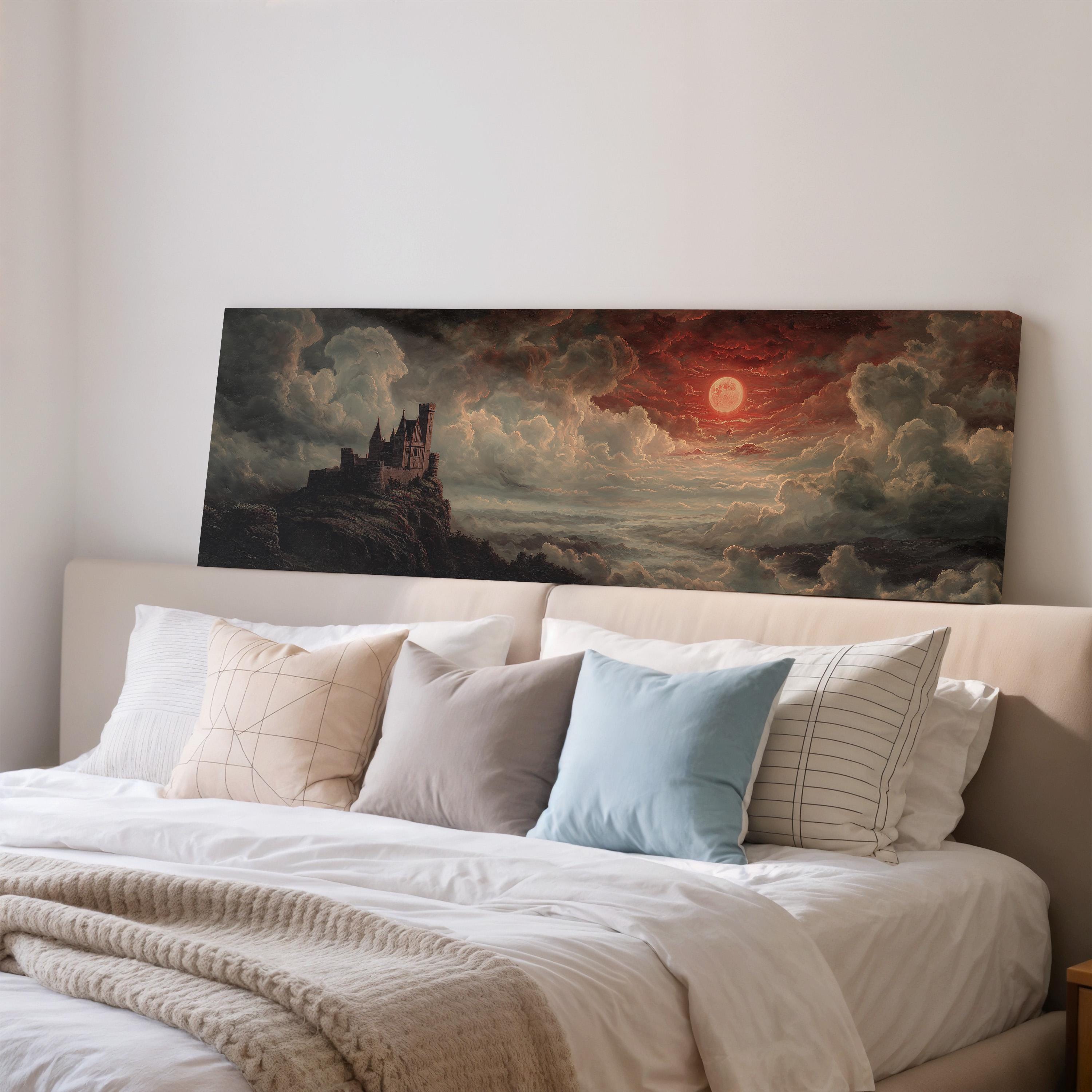 a large painting of a castle on a wall above a bed with white pillows and a gray blanket.