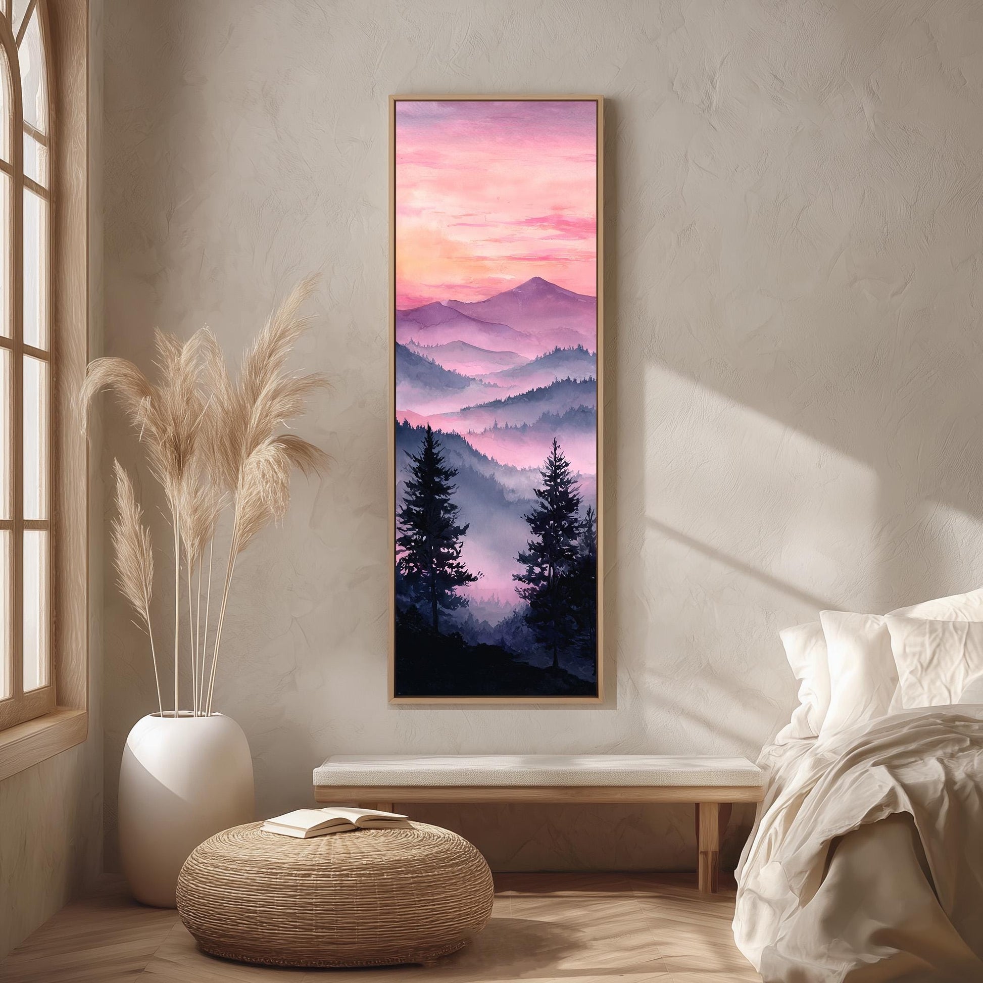 a serene bedroom scene with a large framed painting of a mountain landscape hanging on the wall, depicting a sunset over the mountains. The painting is surrounded by a white bed, a white ottoman, and a potted plant, creating a harmonious and calming atmosphere.