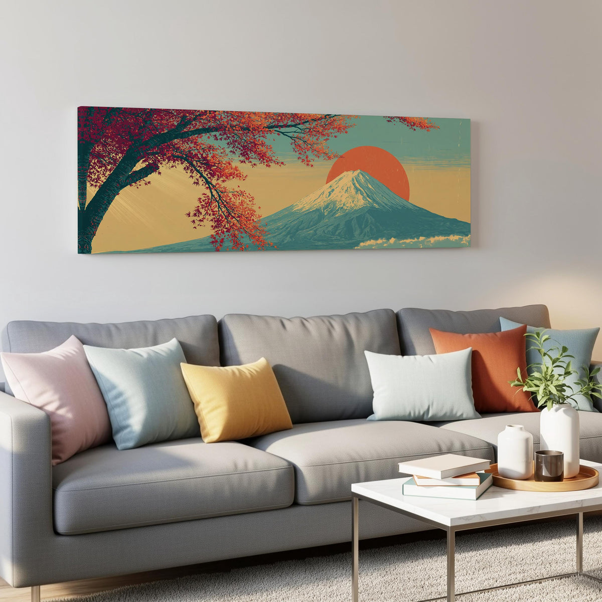 Autumn maple branch and Mount Fuji at sunset panoramic canvas print above a grey sofa in a living room