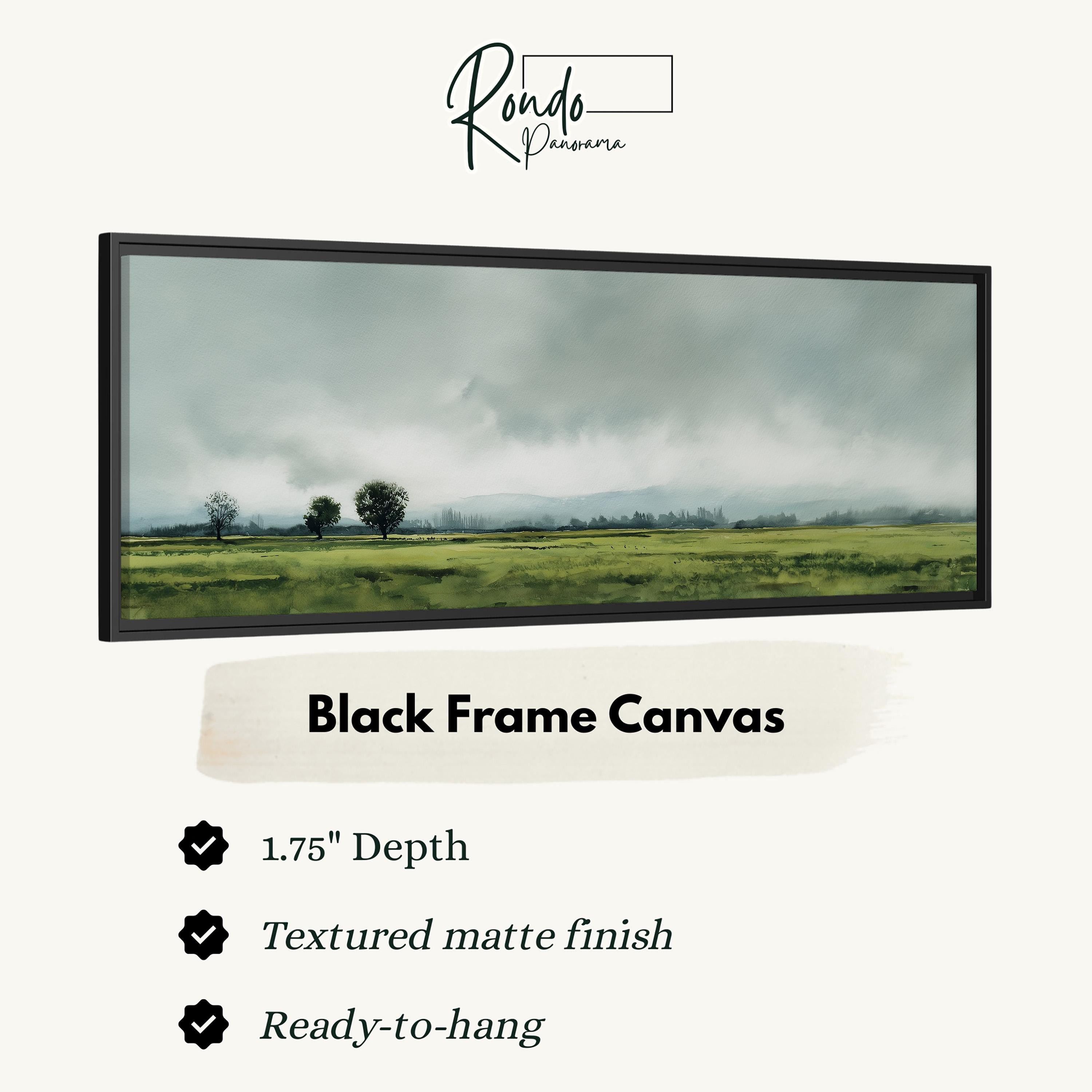 The image is a black frame canvas depicting a landscape with a field and trees under a cloudy sky.