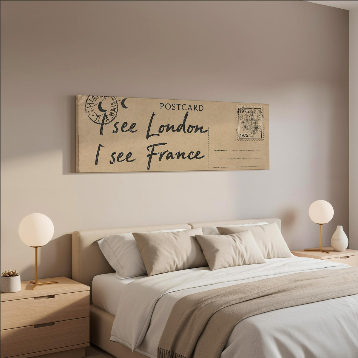 Postcard saying I see London, I see France wide panoramic canvas print above a bed in a neutral bedroom