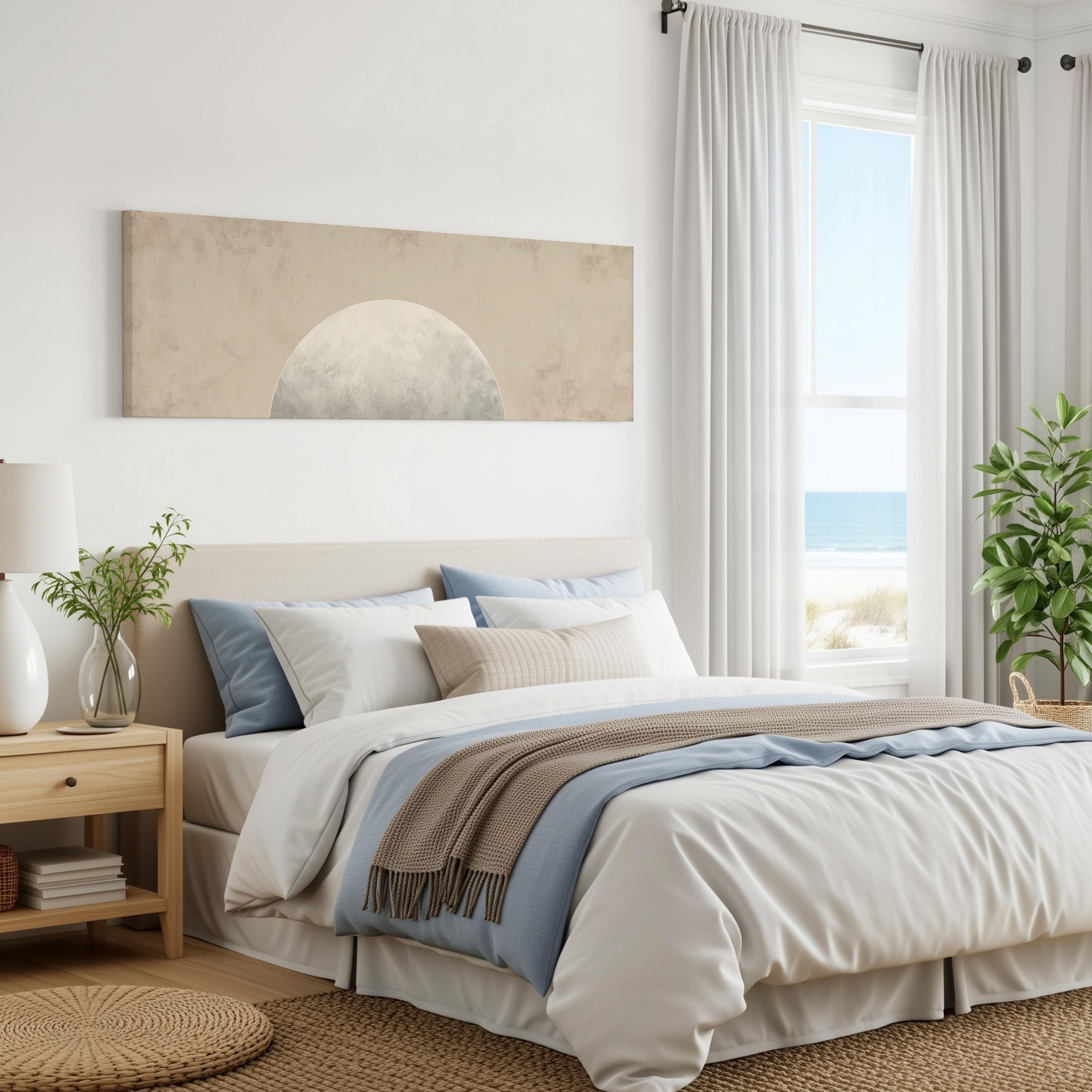 a serene and modern bedroom with a large bed, a nightstand, and a painting on the wall. The room has a beach view, and the overall color scheme is neutral, creating a calm and relaxing atmosphere.