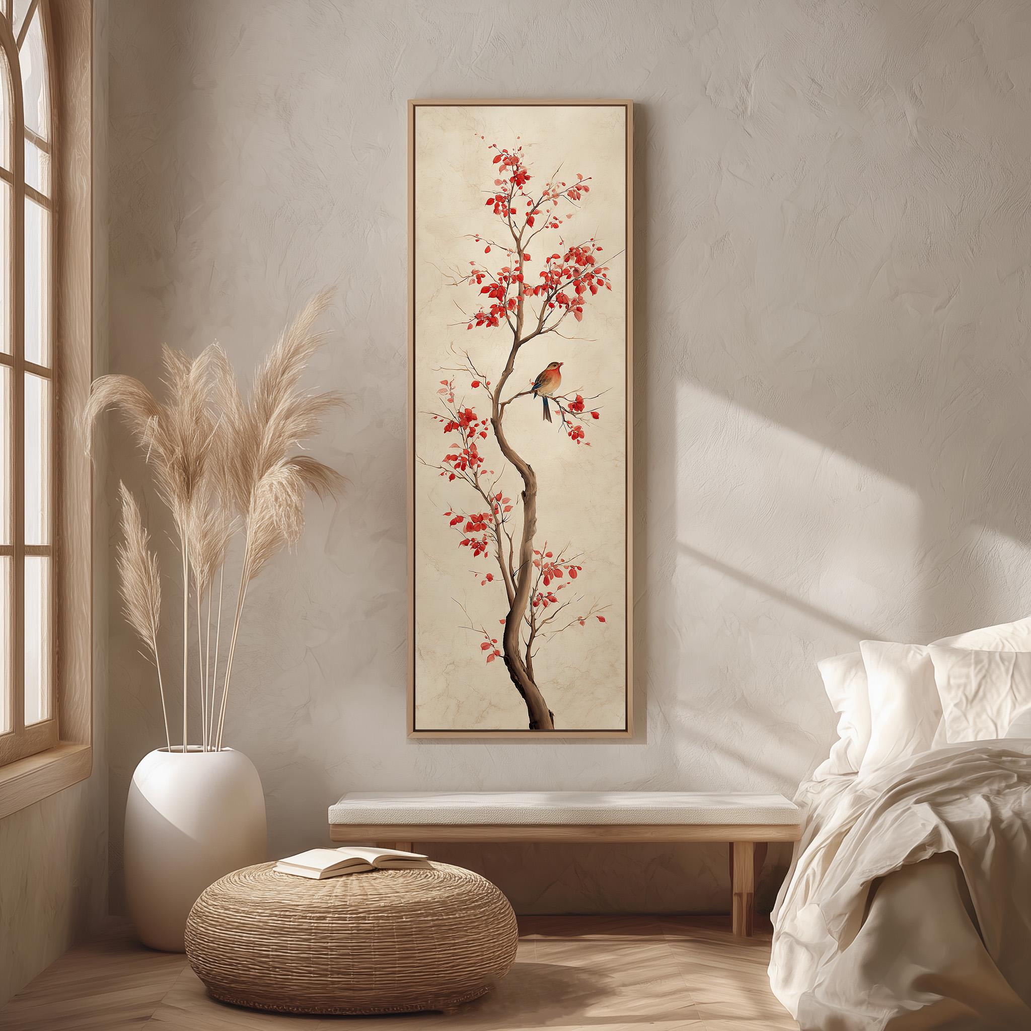 a serene bedroom scene with a large painting of a tree with red flowers hanging on the wall. The painting is framed in a white frame and is the focal point of the room. The room features a bed with white linens, a wicker ottoman, and a potted plant. The overall color scheme of the room is neutral, with the red flowers on the painting adding a pop of color.