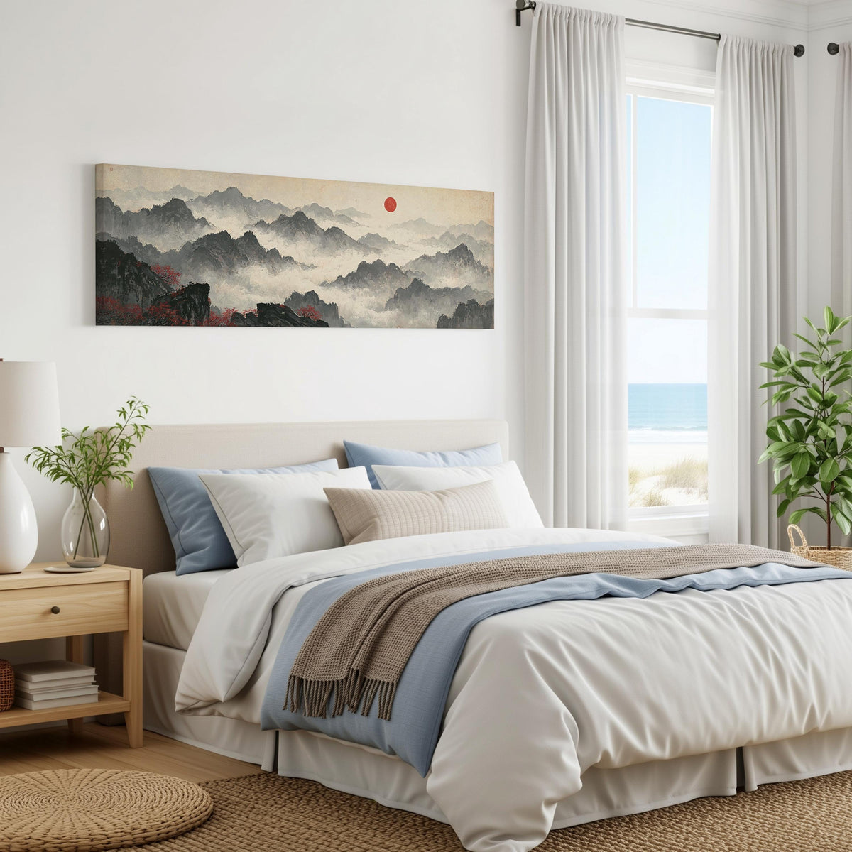 Misty ink mountains under a red sun panoramic canvas print above a bed in a coastal bedroom
