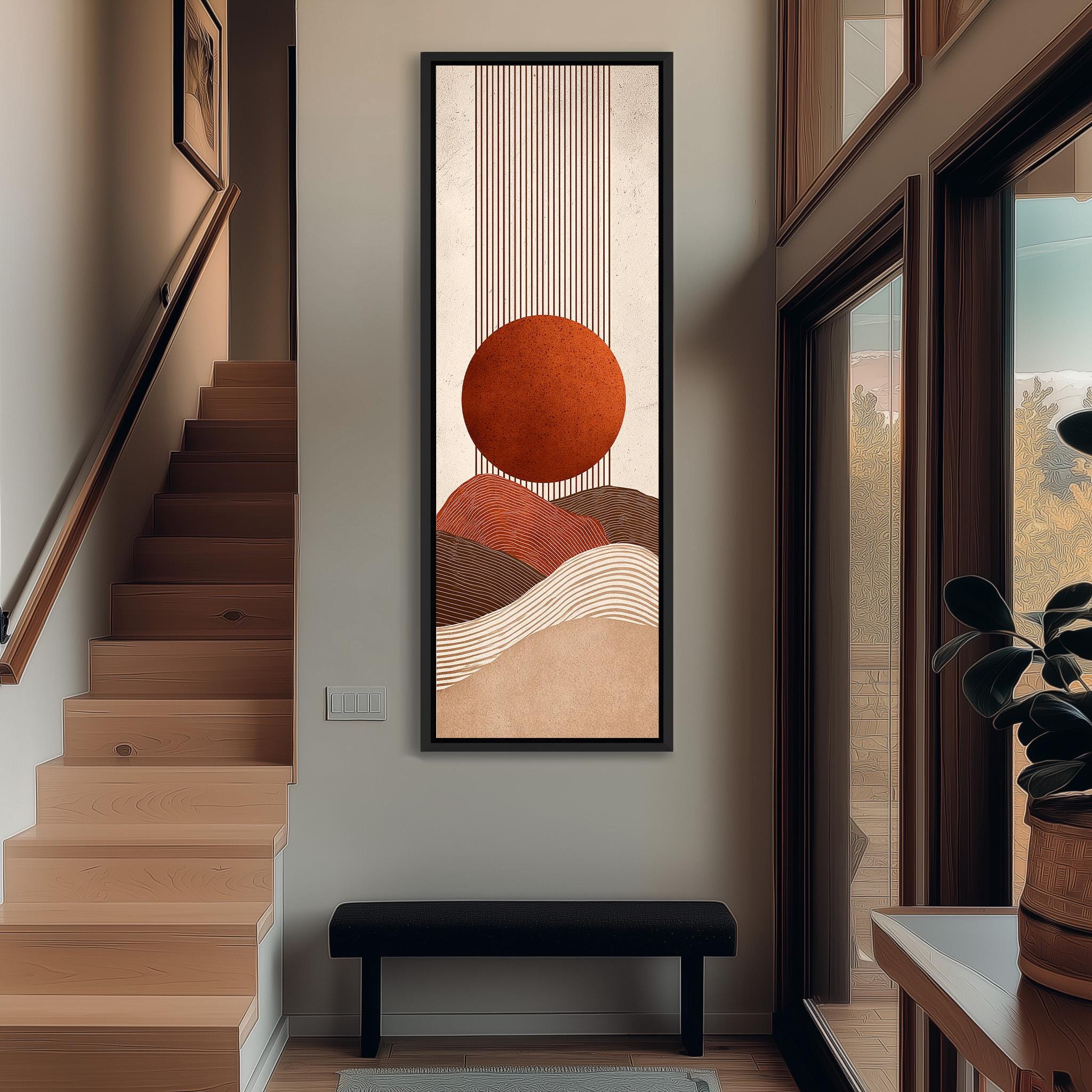 a modern and minimalist interior design with a large abstract painting hanging on the wall above a black bench. The painting depicts a circular shape with a sun-like design in shades of orange and brown, creating a warm and inviting atmosphere. The room also includes a staircase, a potted plant, and a window, contributing to the overall aesthetic and functionality of the space.