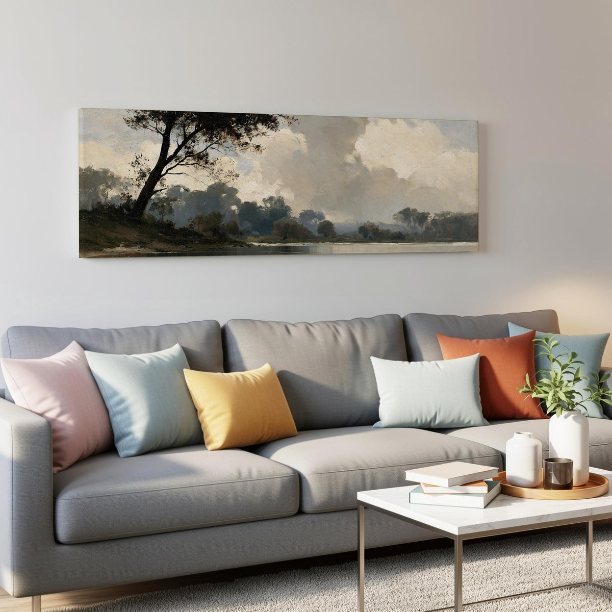 Misty river landscape in grey blue tones panoramic canvas print above a grey sofa in a living room